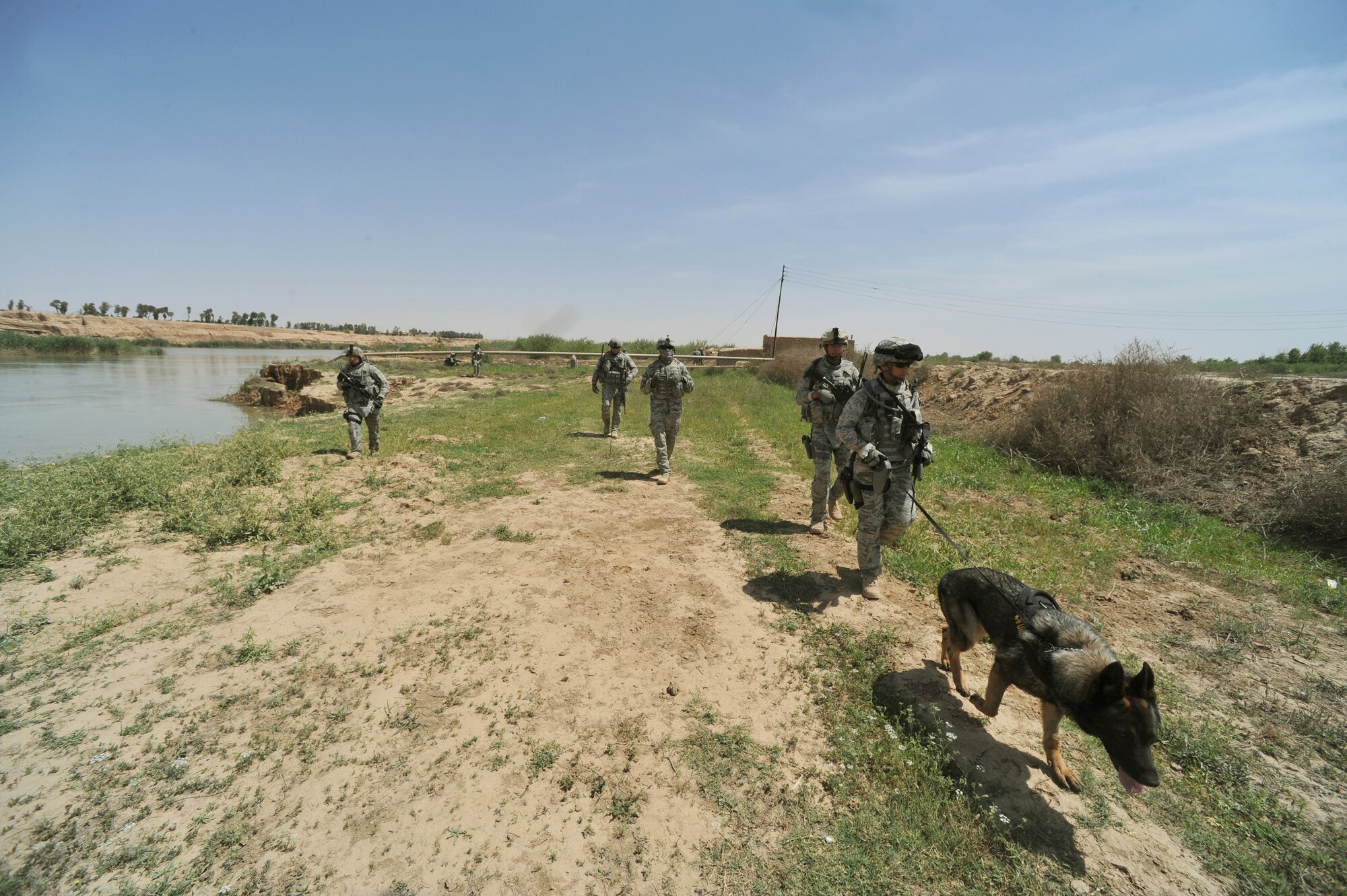 U.S. Air Force security forces defenders perform a dismounted patrol on the outskirts of Joint Base Balad, Iraq, April 14, 2010.  The patrol was a joint effort between U.S. Army and Air Force defenders looking for a weapons cache.  (U.S. Air Force photo/Staff Sgt Quinton Russ/released)
