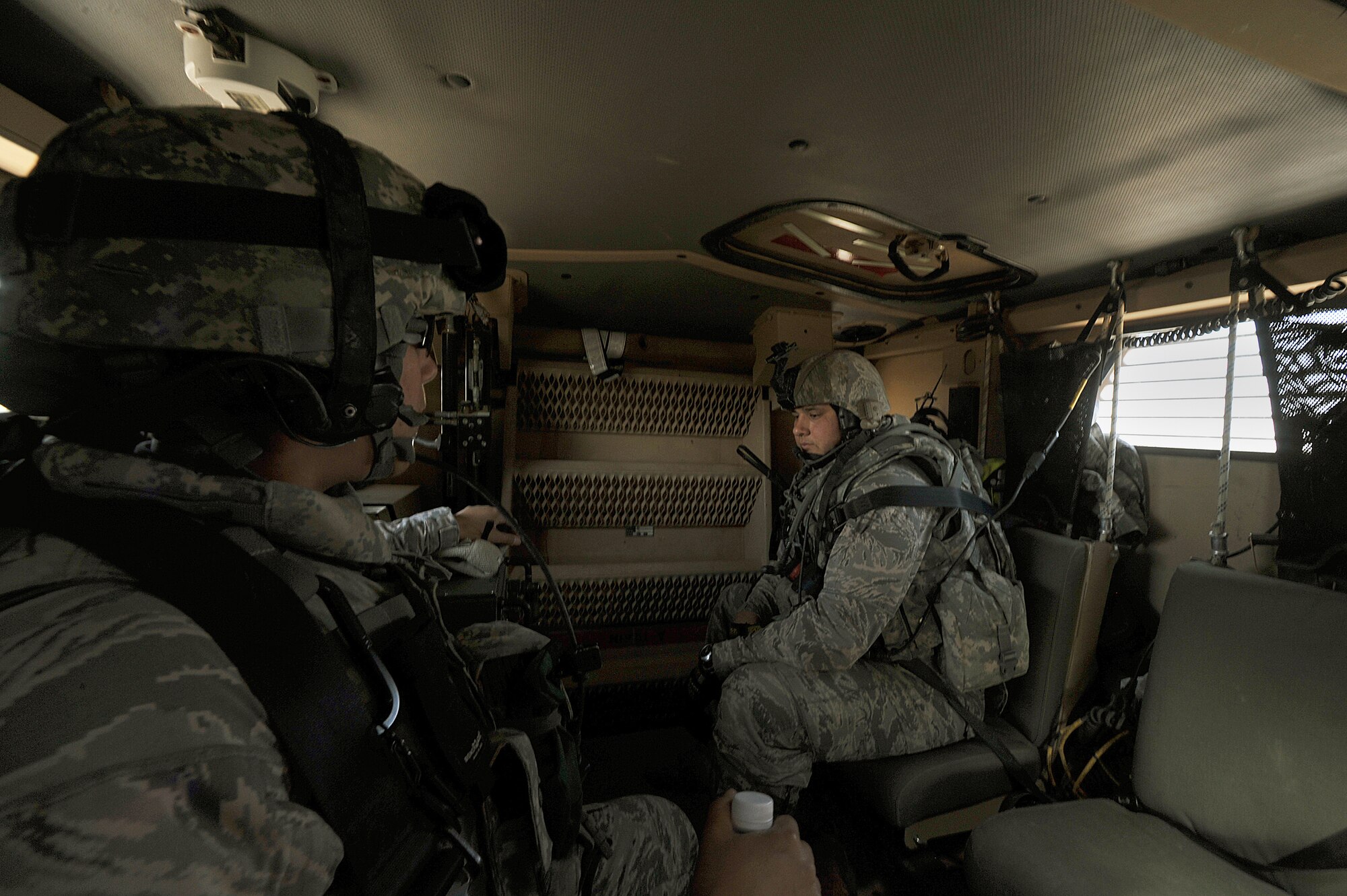 U.S. Air Force security forces Staff Sgt. Wendy Montellese. left, gives Senior Airman Stephen Lotero a radio check in a mine resistant ambush (MRAP) vehicle before a joint dismounted patrol at Joint Base Balad, Iraq, April 14, 2010.  The patrol was a joint effort between U.S. Army and Air Force defenders looking for a weapons cache.  (U.S. Air Force photo/Staff Sgt Quinton Russ/released)