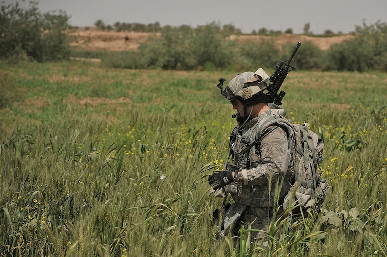 U.S. Air Force Staff Sgt. Benjamin Wilson patrols a field on the outskirts of Joint Base Balad on April 14, 2010.  The patrol was a joint effort between U.S. Army and Air Force defenders looking for weapons cache.  Sgt. Wilson is forward deployed to the 532nd Expeditionary Security Forces Squadron from Vandenberg AFB, Calif.(U.S. Air Force photo/Staff Sgt Quinton Russ/released)