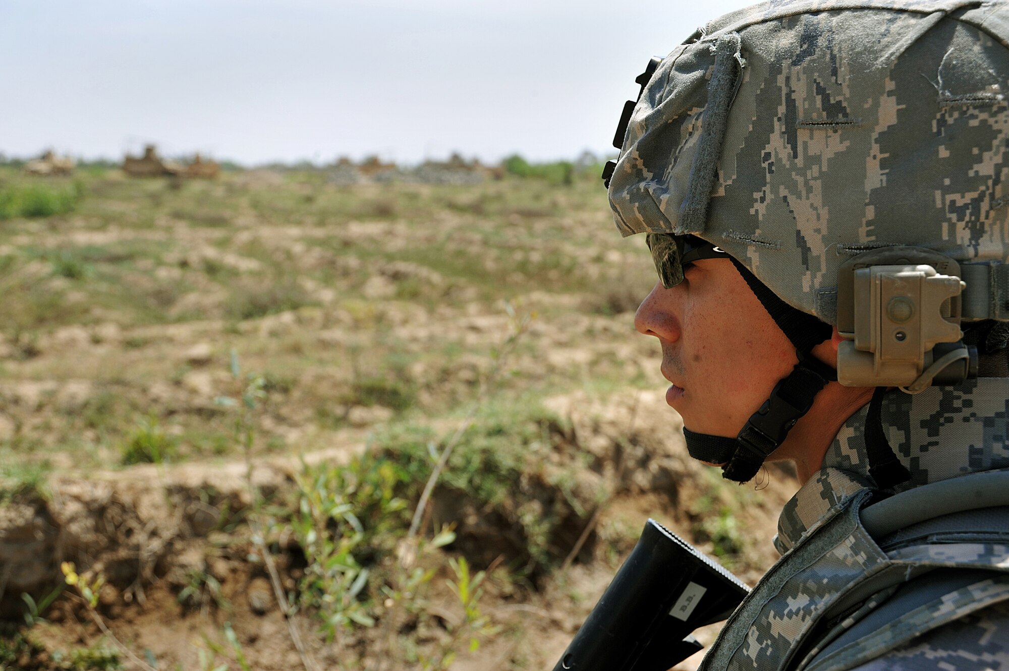 Airman Jonathen Gonzalez scans the countryside on the outskirts of Joint Base Balad April 14, 2010.  The patrol was a joint effort between U.S. Army and Air Force defenders looking for weapons cache.  Airman Gonzalez is forward deployed to the 532nd Expeditionary Security Forces Squadron from Vandenberg AFB, Calif.  (U.S. Air Force photo/Staff Sgt Quinton Russ/released)