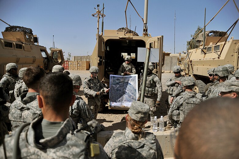 U.S. Airmen and Soldiers brief before a patrol at Joint Base Balad, Iraq, April 14, 2010.  The patrol was a joint effort between U.S. Army and Air Force defenders looking for a weapons cache.  (U.S. Air Force photo/Staff Sgt Quinton Russ/released)