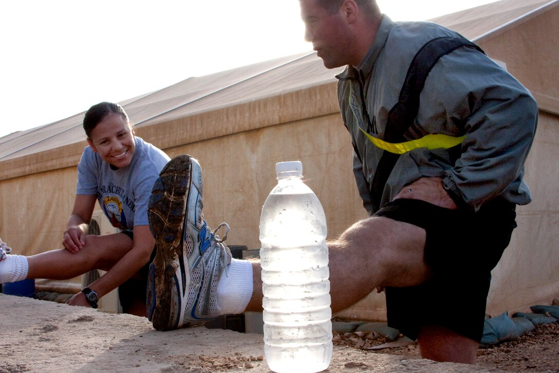 U.S. Army Chief Warrant Officer Yenny Giusto and Staff Sgt. Denny