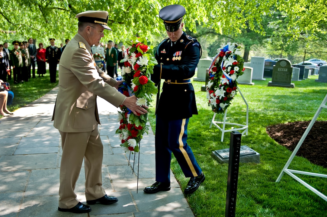 U.S. Navy Adm. Mike Mullen, chairman of the Joint Chiefs of Staff, presents a wreath in Arlington National Cemetery, Va., April 23, 2010, at the memorial commemorating the 65th anniversary of the the link up of U.S. and Soviet forces during World War II at Elbe River in Germany, April 25, 1945.