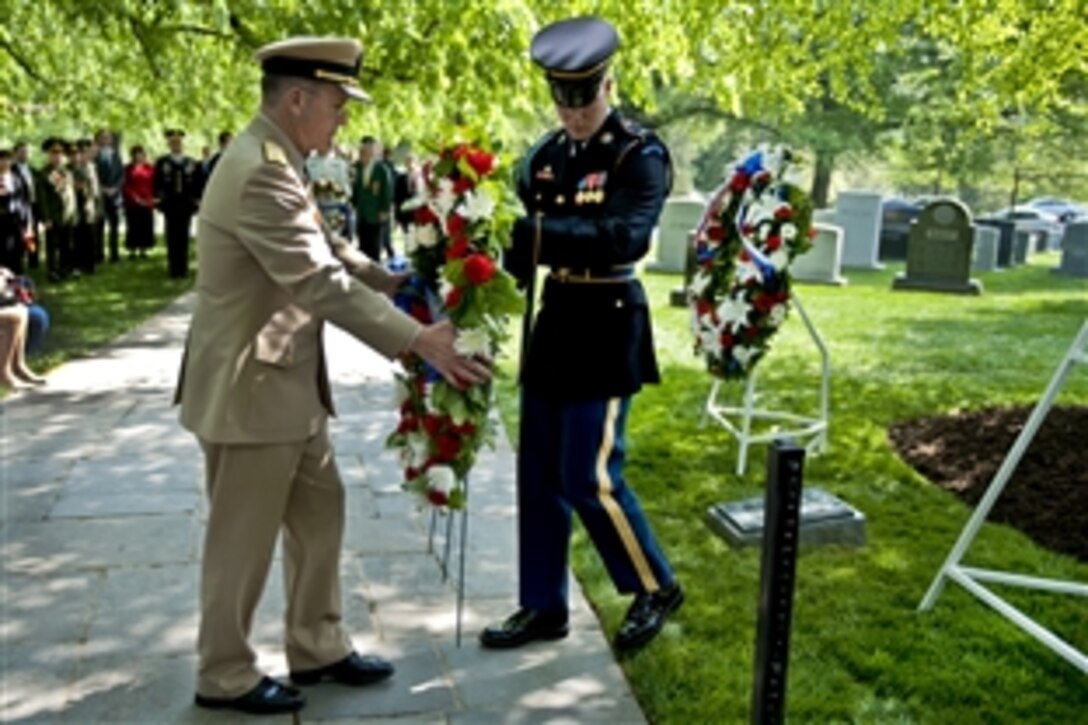 U.S. Navy Adm. Mike Mullen, chairman of the Joint Chiefs of Staff, presents a wreath in Arlington National Cemetery, Va., April 23, 2010, at the memorial commemorating the 65th anniversary of the link up of U.S. and Soviet forces during World War II at Elbe River in Germany, April 25, 1945.