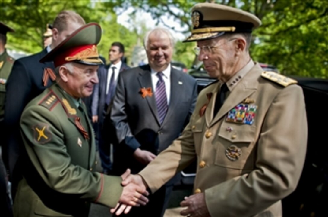 U.S. Navy Adm. Mike Mullen, chairman of the Joint Chiefs of Staff, and Russian Gen. Nikolay Makarov, chief of the General Staff of the Russian Federation, bid farewell at Arlington National Cemetery, Va., April 23, 2010. The leaders participated in a wreath-laying ceremony commemorating the 65th anniversary of the link up of U.S. and Soviet forces during World War II at Elbe River in Germany, April 25, 1945. 