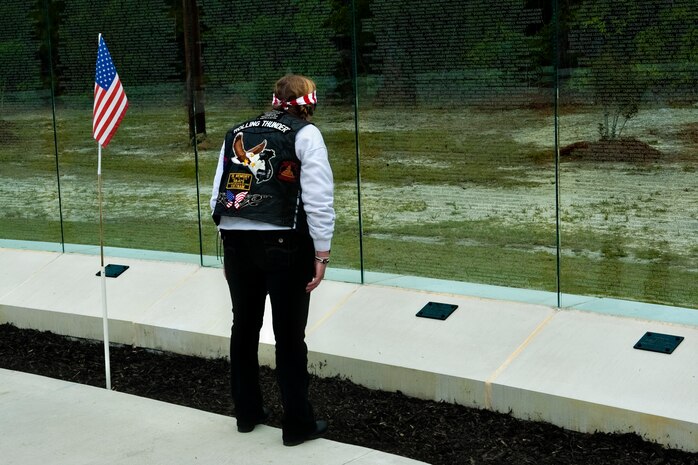 A member of the NC-5 chapter of Rolling Thunder, an organization for Vietnam War veterans, looks upon the walls of the Vietnam Veterans Memorial portion of the Lejeune Memorial Gardens after the Vietnam Recognition Day, April 24. The event is in remembrance of all Vietnam veterans and the mental and physical scars they live with every day.