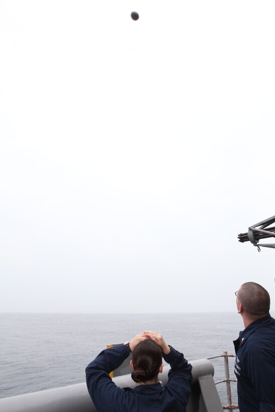 Petty Officer 2nd Class Maria J. Perez, an aerographer’s mate from the Meteorological and Oceanographic (METOC) section with Strike Group Oceanography Team (SGOT), Norfolk, Va., watches as a weather balloon flies off during an Amphibious Squadron (PHIBRON)/Marine Expeditionary Unit Integration (PMINT) training exercise aboard USS Kearsarge near the coast of North Carolina, April 24, 2010. Attached to the weather balloon is a deployable data transmission system which sends information to a receiver on the ship. METOC sailors and 26th Marine Expeditionary Unit weather forecasters use the data for real-time weather conditions and weather forecasting. 26th MEU is embarked aboard USS Kearsarge, USS Carter Hall, and USS New York for PMINT.