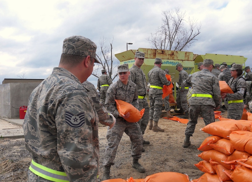 Members of the Kentucky Air National Guard fill sandbags at the Gulfport Combat Readiness Training Center in Gulfport, Miss., on March 21, 2010. The Guard members and Airmen from two other Air Force units provided theater airlift services in support of a simulated G8 Summit in New Orleans. (U.S. Air Force photo/Tech. Sgt. Dennis Flora)