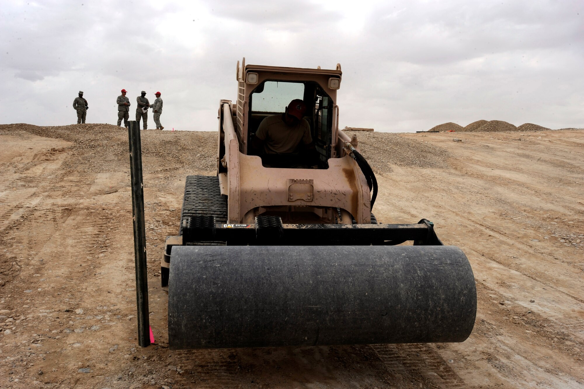 Senior Airman Adam Bishop, a heavy-equipment operator assigned to the 1st Expeditionary RED HORSE Group, backs a bulldozer out an evaporation pond work site, April 19, 2010, at Camp Leatherneck, Afghanistan. (U.S. Air Force photo/Staff Sgt. Manuel J. Martinez/released)