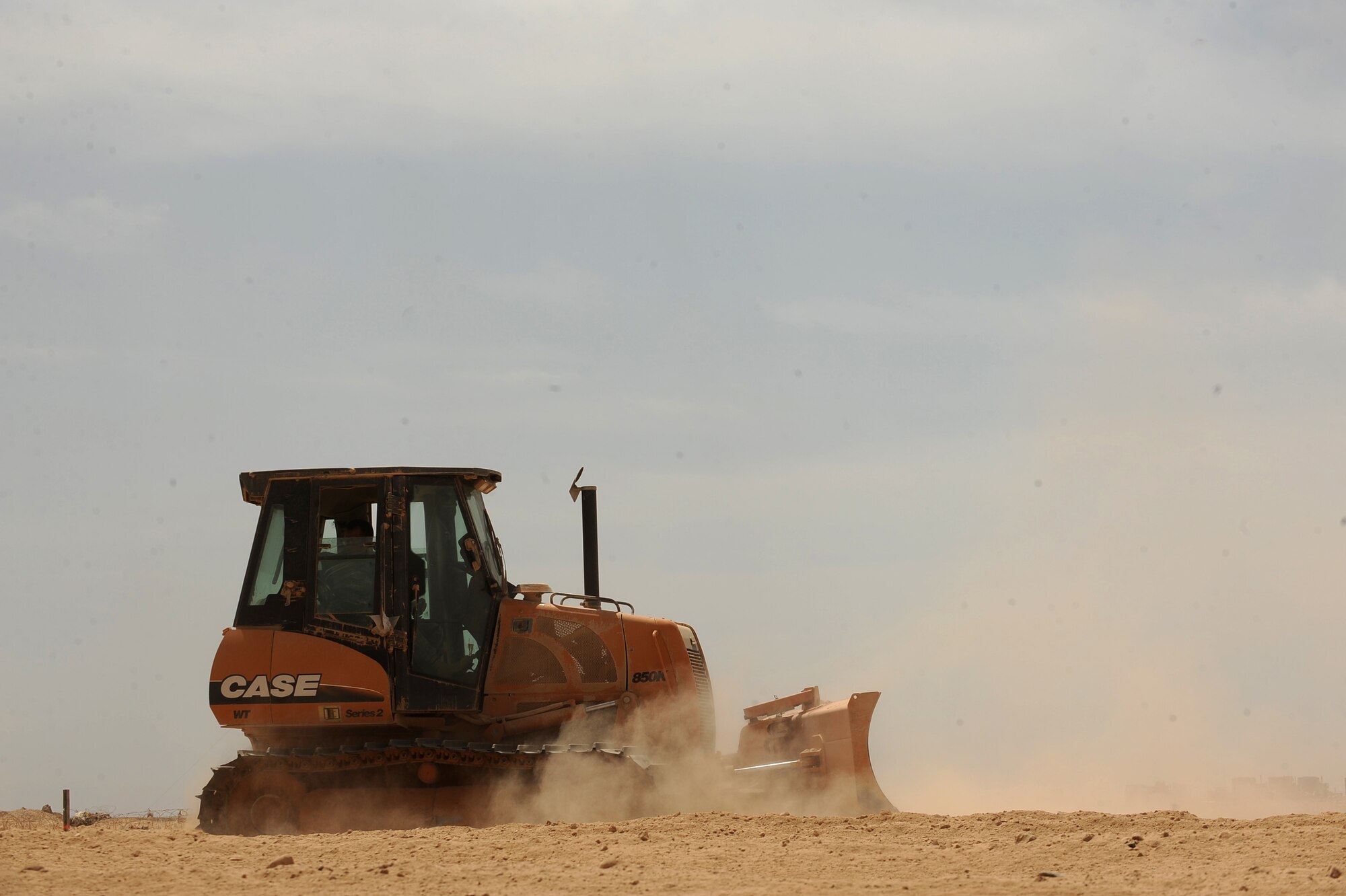 Staff Sgt. Johnathan Collins, a heavy-equipment operator assigned to the 1st Expeditionary RED HORSE Group, utilizes a   bulldozer to clear the land at the site of a future Red Horse compound, April 19, 2010, at Camp Leatherneck, Afghanistan. ?Our mission here is to construct the facilities that directly support the joint Coalition warfighter,? said Capt. Nick Anderson, 1st ERED HORSE Group officer in charge deployed from Nellis Air Force Base, Nev. ?We have a young and energetic  team, we're small but we are making a big impact.? (U.S. Air Force photo/Staff Sgt. Manuel J. Martinez/released)