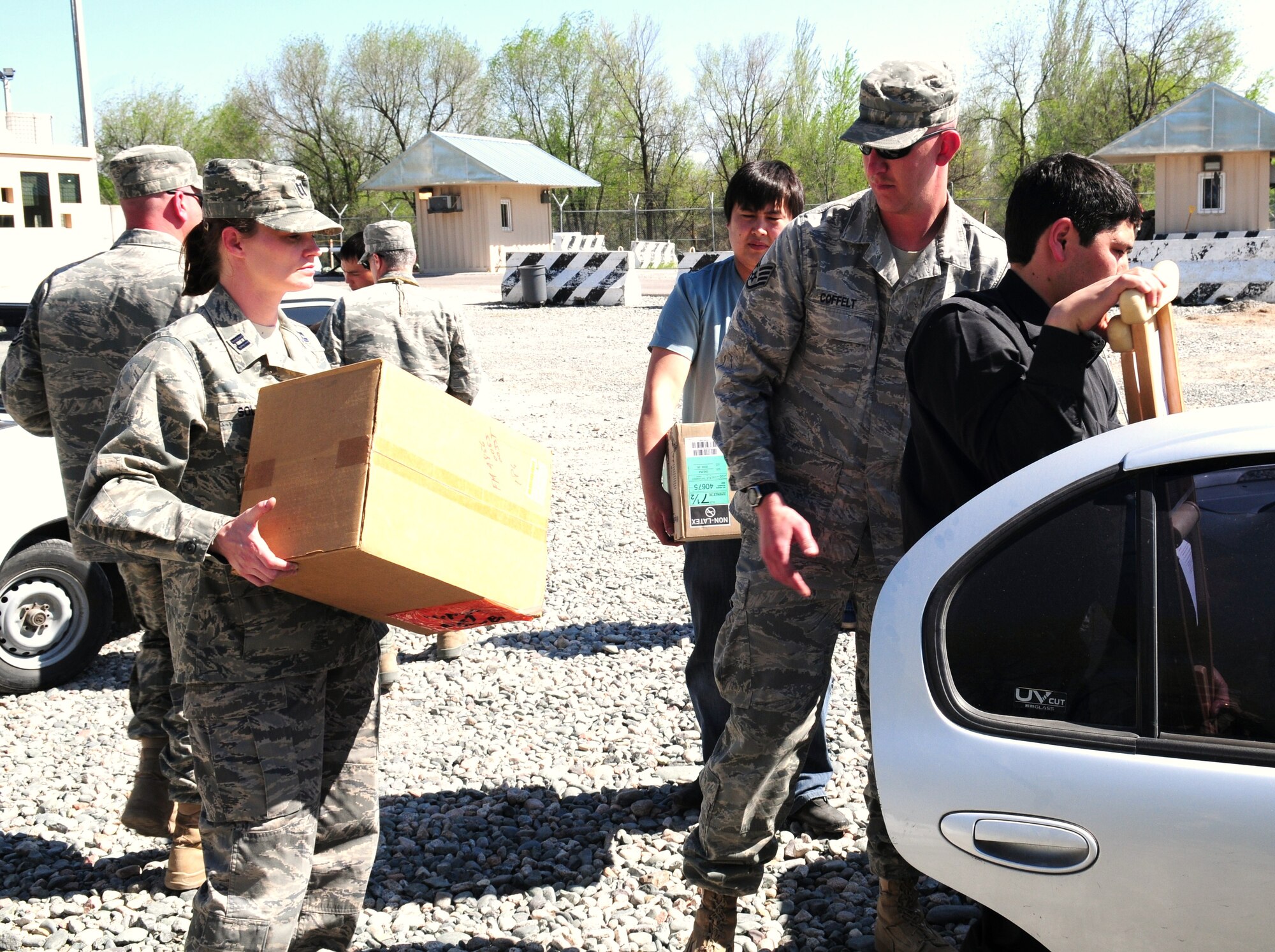 Airmen from the 376th Expeditionary Medical Group and representatives from the Center for Traumatology and Orthopedics load medical supplies donated by the Transit Center at Manas, Kyrgyzstan, April 23, 2010.  The EMDG donated approximately $83,000 of medical supplies between three local hospitals in Bishkek, Kyrgyzstan. (U.S. Air Force photo/Senior Master Sgt. Mike Litsey/released)