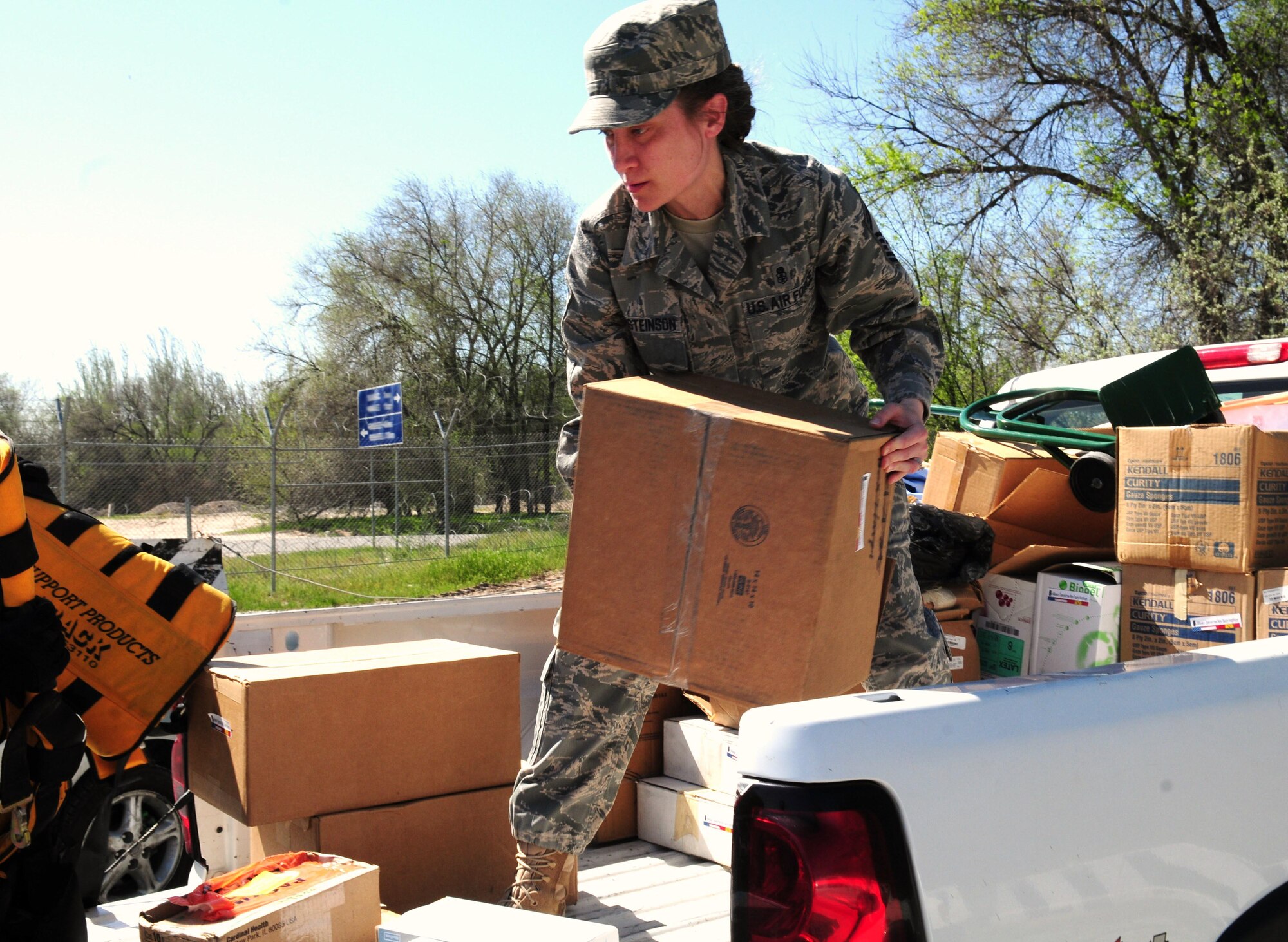 Senior Master Sgt. Michelle Thorsteinson-Richards, 376th Expeditionary Medical Group superintendent, unloads medical supplies donated by the Transit Center at Manas to three local hospitals in Bishkek, Kyrgyzstan, April 23, 2010.  The EMDG donated approximately $83,000 of medical supplies between the three hospitals. (U.S. Air Force photo/Senior Master Sgt. Mike Litsey/released) 