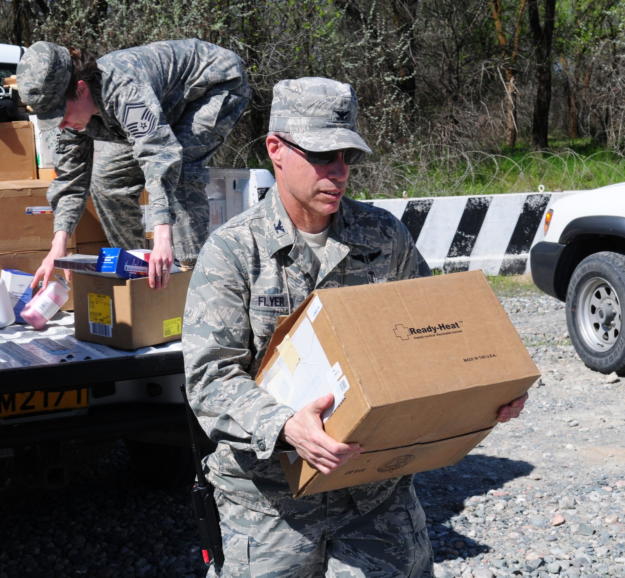 Col. Jerry Flyer, 376th Expeditionary Medical Group commander, unloads medical supplies donated by the Transit Center at Manas to three local hospitals in Bishkek, Kyrgyzstan, April 23, 2010.  The EMDG donated approximately $83,000 of medical supplies between the three hospitals. (U.S. Air Force photo/Senior Master Sgt. Mike Litsey/released)