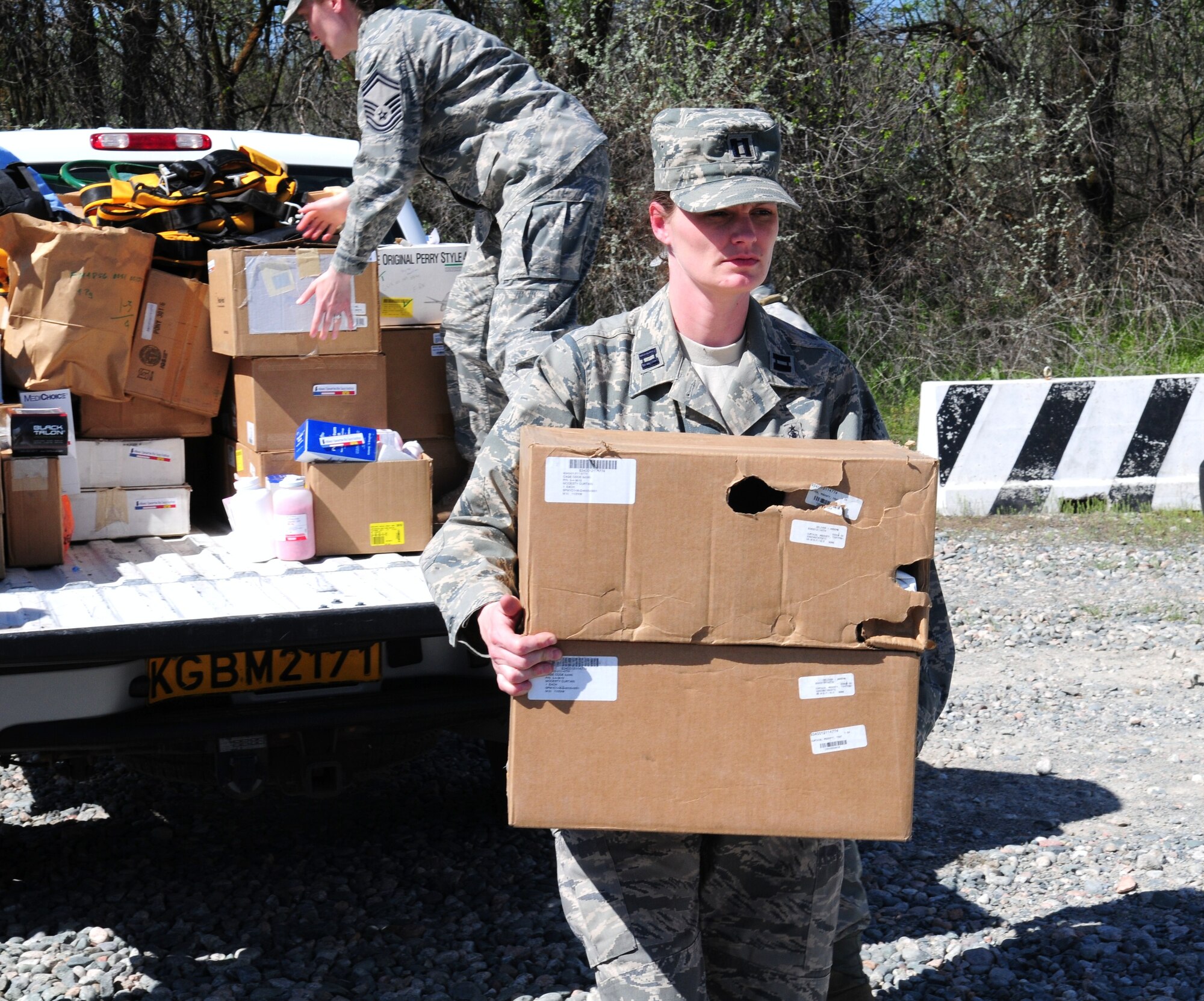 Capt. Steffanie Solberg, 376th Expeditionary Medical Group chief nurse, unloads medical supplies donated by the Transit Center at Manas to three local hospitals in Bishkek, Kyrgyzstan, April 23, 2010.   The EMDG donated approximately $83,000 of medical supplies between the three hospitals. (U.S. Air Force photo/Senior Master Sgt. Mike Litsey/released)