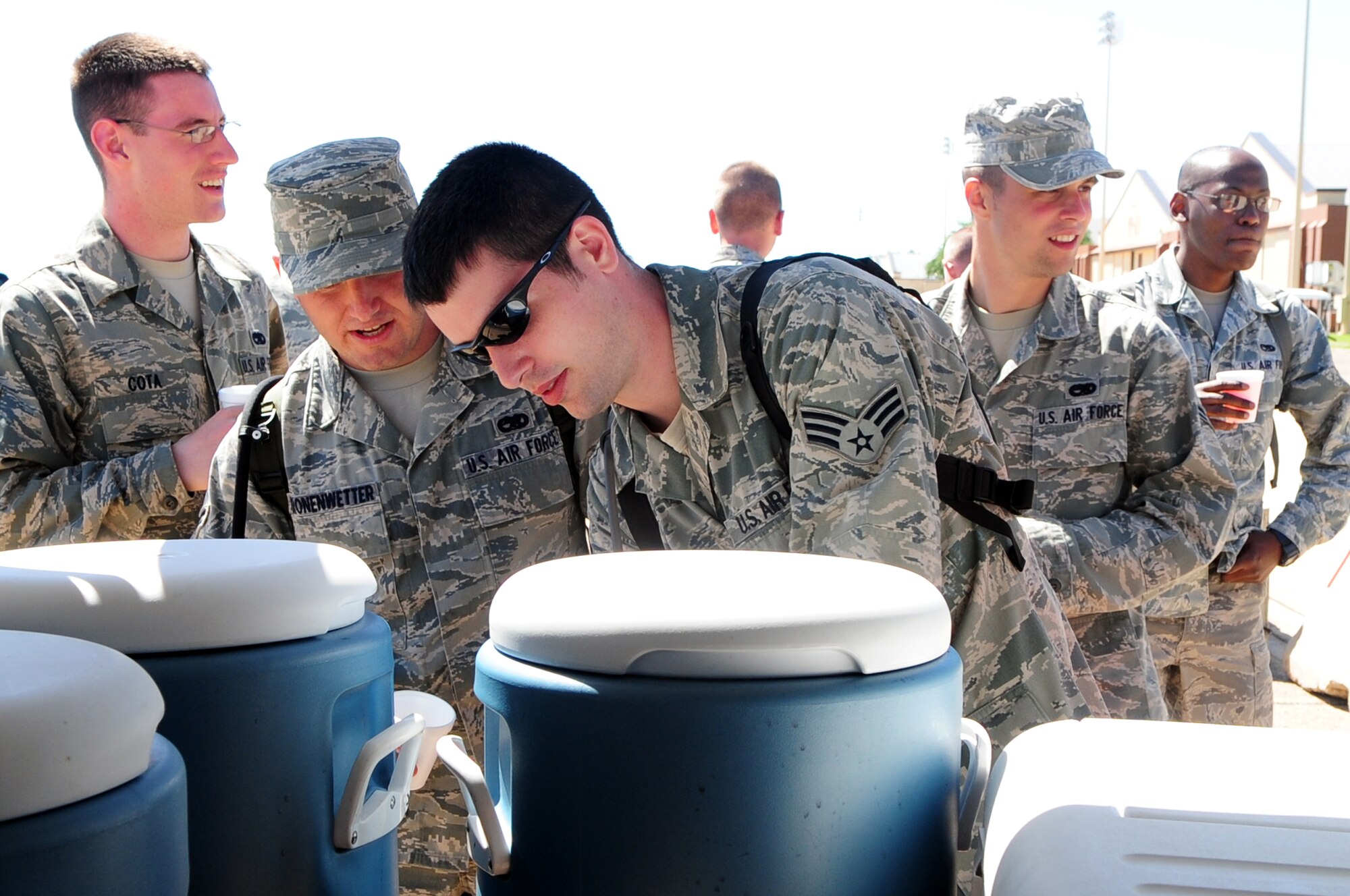 BARKSDALE AIR FORCE BASE, La. -- Defenders of Liberty Air Show volunteers help themselves to Kool-Aid and water April 25.The drinks were provided by the First Sergeants council, who spent the weekend making sure Airmen posted at all corners of the base received proper hydration at least twice during each air show day. (U.S. Air Force photo by Senior Airman Joanna M. Kresge)