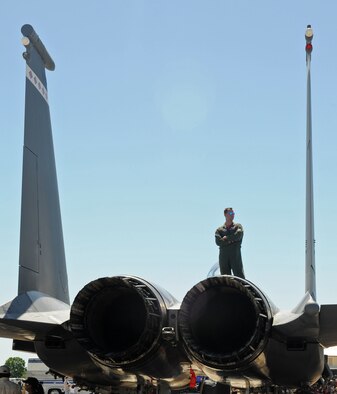 BARKSDALE AIR FORCE BASE, La. – Capt. Chris Duplin, 40th Flight Test Squadron from Eglin AFB, Fla. stands atop an F-15E as he observes the Barksdale 2010 Defenders of Liberty Air Show April 24. This year’s premier act was the USAF Aerial Demonstration Team, the Thunderbirds. (U.S. Air Force photo by Senior Airman Alexandra M. Longfellow) (RELEASED)