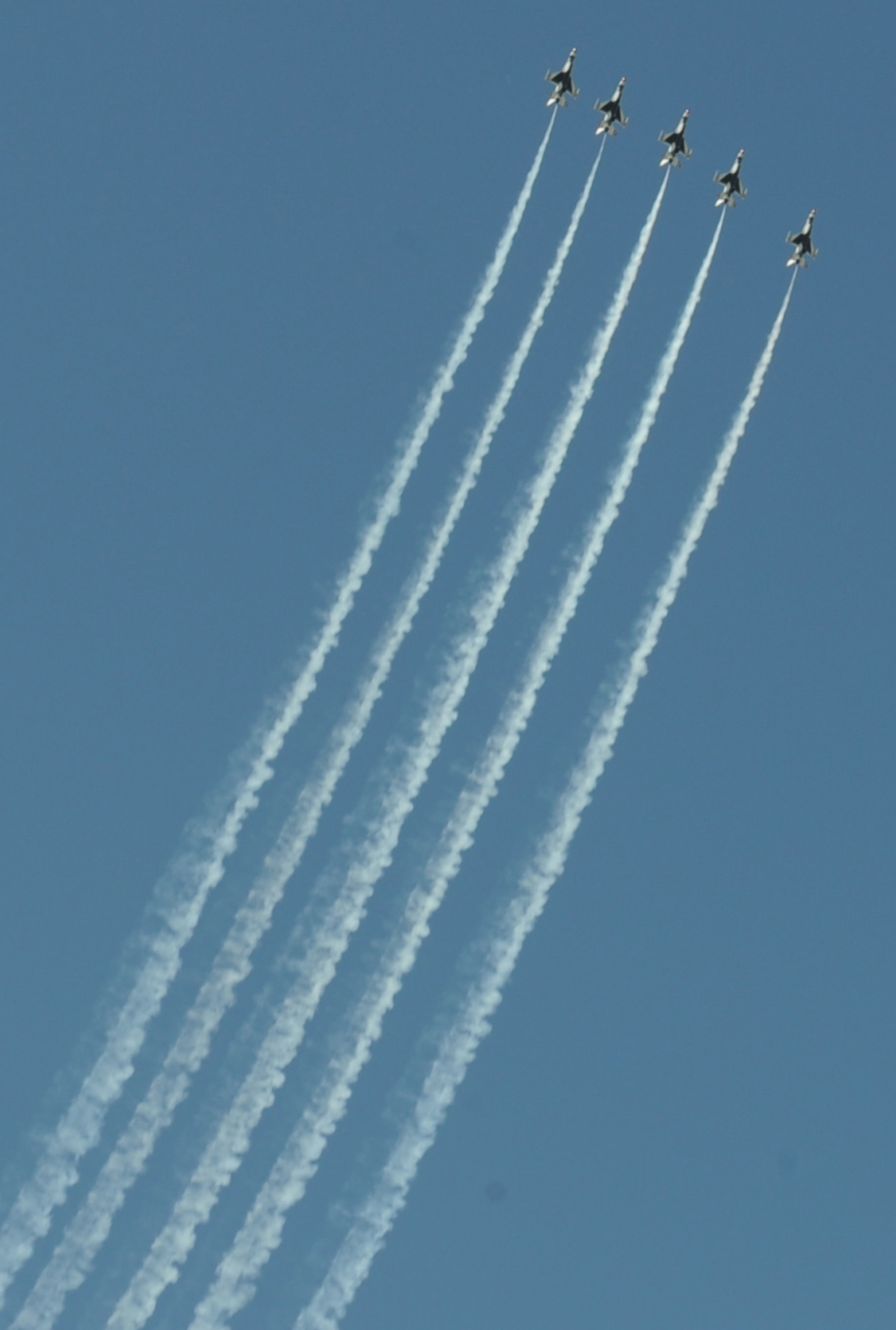 BARKSDALE AIR FORCE BASE, La. – Five of the six F-16 Thunderbirds prepare to perform the line abreast loop during the Barksdale 2010 Defenders of Liberty Air Show. The thunderbirds perform approximately 16 aerial maneuvers during their act. (U.S. Air Force photo by Senior Airman Alexandra M. Longfellow) (RELEASED)