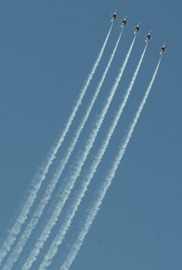 BARKSDALE AIR FORCE BASE, La. – Five of the six F-16 Thunderbirds prepare to perform the line abreast loop during the Barksdale 2010 Defenders of Liberty Air Show. The thunderbirds perform approximately 16 aerial maneuvers during their act. (U.S. Air Force photo by Senior Airman Alexandra M. Longfellow) (RELEASED)