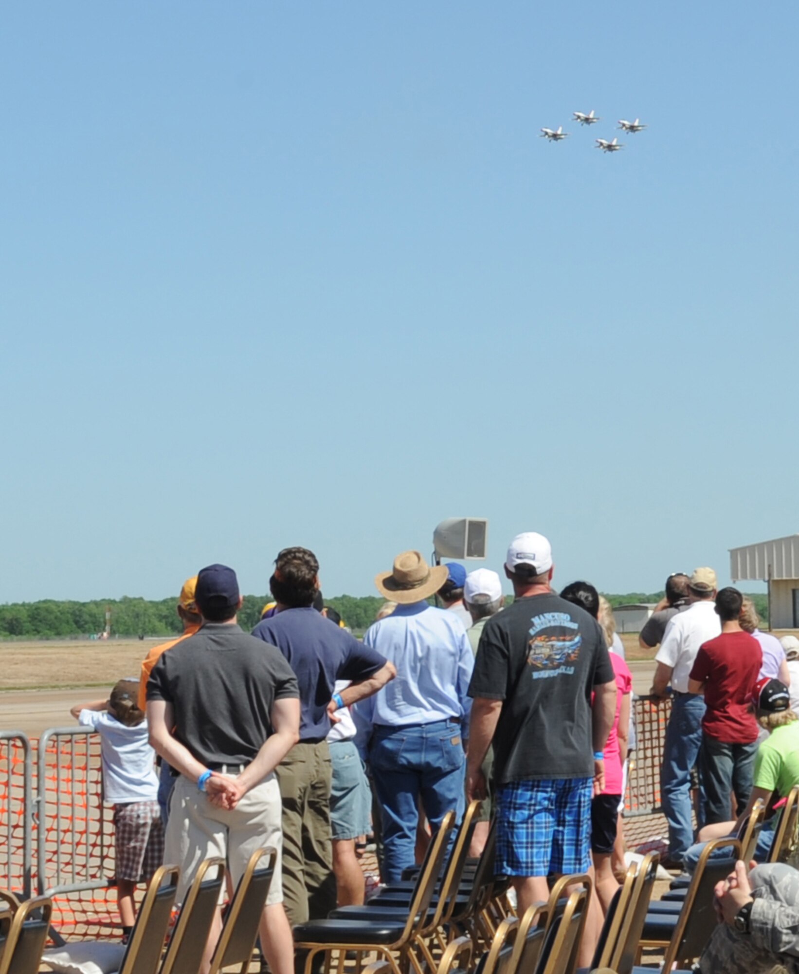 BARKSDALE AIR FORCE BASE, La. – Spectators gaze at the sky as the USAF Aerial Demonstration Team, the Thunderbirds, perform the diamond formation at the Barksdale 2010 Defenders of Liberty Air Show April 24. The Thunderbirds performed April 24 and 25. (U.S. Air Force photo by Senior Airman Alexandra M. Longfellow) (RELEASED)