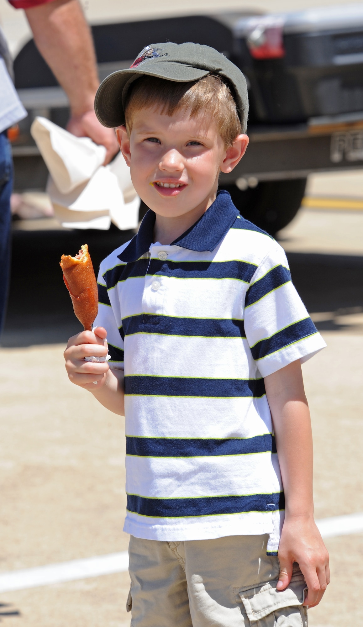 BARKSDALE AIR FORCE BASE, La. – Alex Barnette, 5, son of Melissa Barnette from Homer, La., savors a corn dog while attending the Barksdale 2010 Defenders of Liberty Air Show April 24. During the air show many off-base vendors provide concessions for people attending the air show. (U.S. Air Force photo by Senior Airman Alexandra M. Longfellow) (RELEASED)