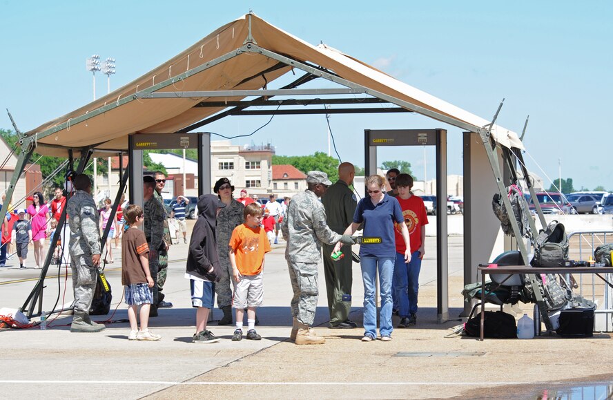 BARKSDALE AIR FORCE BASE, La. – 2d Security Forces Squadron search for contraband prior to admittance to the Barksdale 2010 Defenders of Liberty Air Show.  The USAF Aerial Demonstration Team, the Thunderbirds were the headlining act during this year’s show and performed on both days. (U.S Air Force photo by Senior Airman Alexandra M. Longfellow) (RELEASED) 