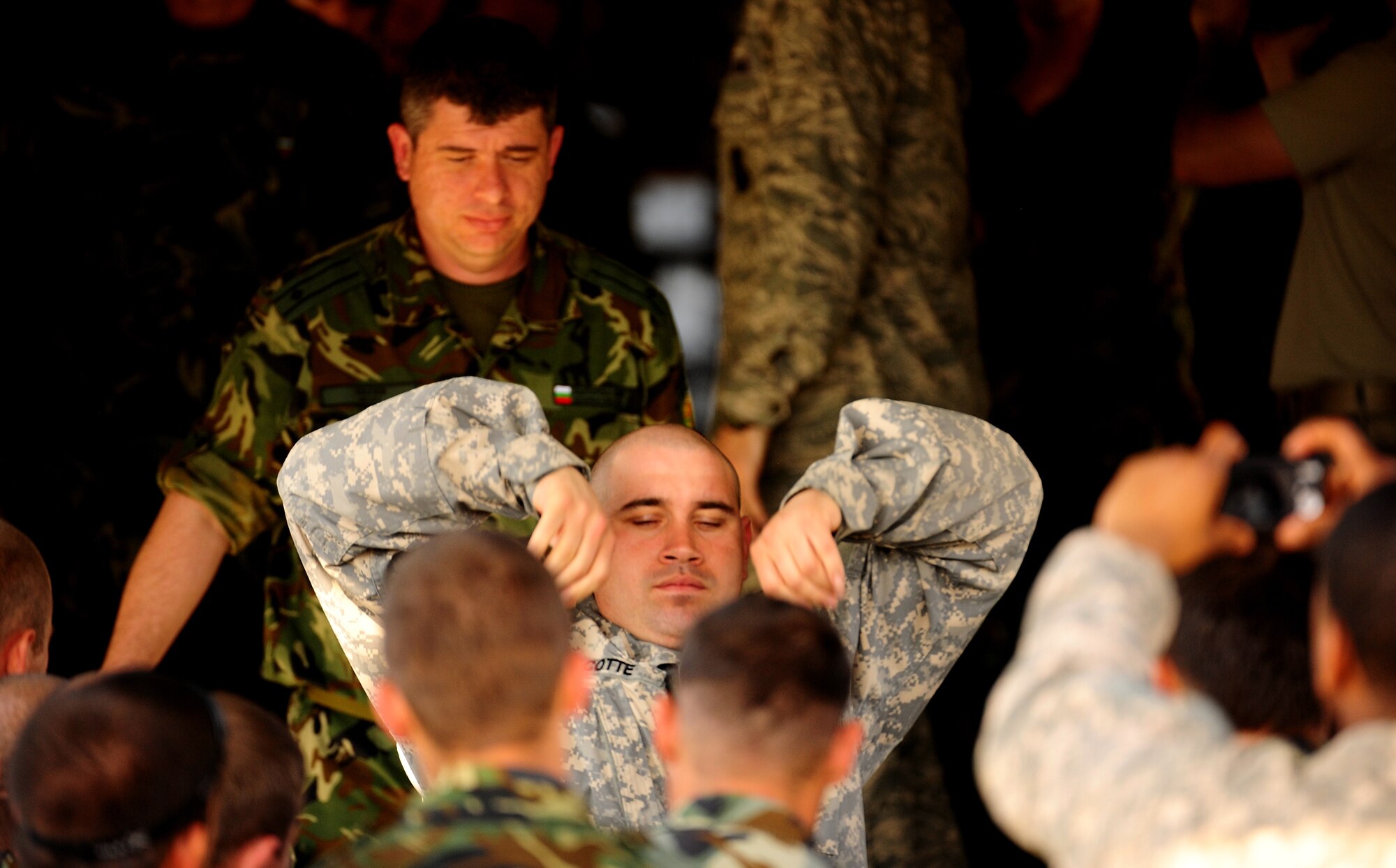 U.S. Army Sgt. Angel Cotte, jumpmaster from the 5th Quartermaster Company, provides jump training to members of the Bulgarian Special Forces and Search & Rescue teams in preparation for future jumps during exercise Thracian Spring 2010 at Plovdiv Airport, April 22, 2010. Personnel from the 86th Airlift Wing and 435th Air and Ground Operations Wing are deployed to Plovdiv, Bulgaria in support of Thracian Spring. Thracian Spring is an exercise composed of aircrew, maintenance, airfield management, aerial port, security forces, and logistics personnel that combine their skill in an effort to build and strengthen the United States and Bulgarian Air Forces’ bond while improving interoperability with our partner NATO nation. (U.S. Air Force photo by Master Sgt. Quinton T. Burris)