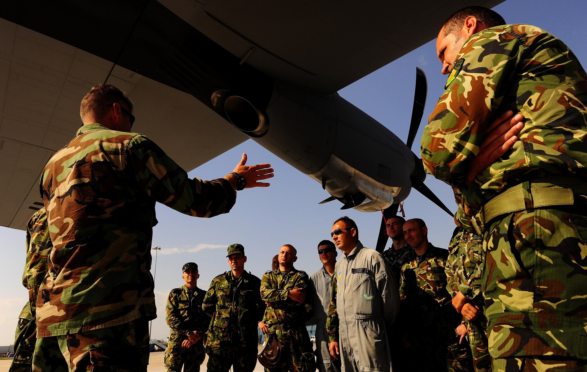 U.S. Navy Chief Petty Officer Nate Spencer, jumpmaster with the Explosive Ordinance Mobile Unit 8 at Sigonella, Sicily, provides jump training to members of the Bulgarian Special Forces and Search & Rescue teams in preparation for future jumps during exercise Thracian Spring 2010 at Plovdiv Airport, April 22, 2010. Personnel from the 86th Airlift Wing and 435th Air and Ground Operations Wing are deployed to Plovdiv, Bulgaria in support of Thracian Spring. Thracian Spring is an exercise composed of aircrew, maintenance, airfield management, aerial port, security forces, and logistics personnel that combine their skill in an effort to build and strengthen the United States and Bulgarian Air Forces’ bond while improving interoperability with our partner NATO nation. (U.S. Air Force photo by Master Sgt. Quinton T. Burris)