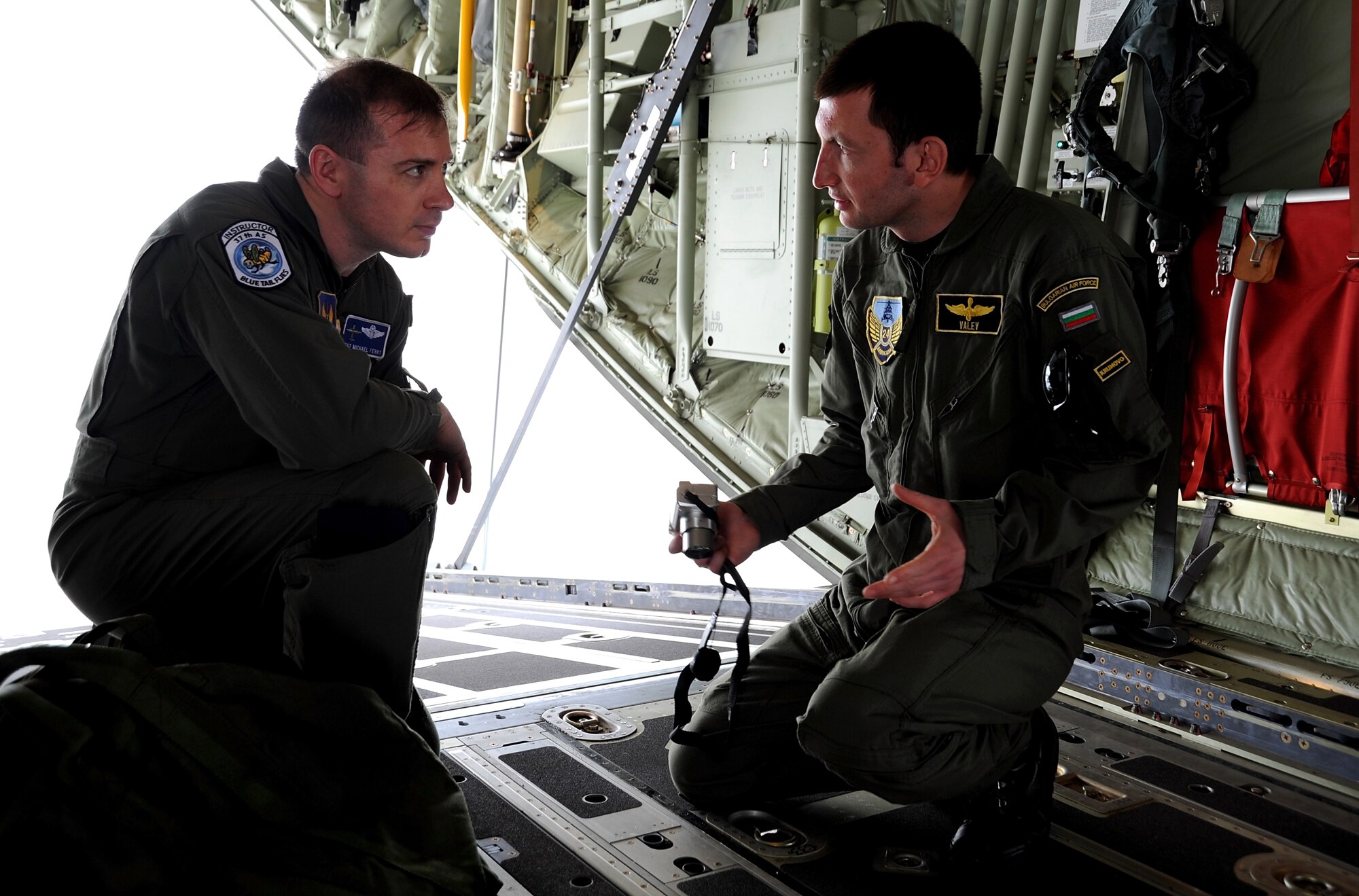 U.S. Air Force Tech. Sgt. Michael Ferry, a loadmaster from the 37th Airlift Squadron, explains how equipment is loaded onto a U.S. Air Force C-130J to Bulgarian Lt. Hristo Valev, a Mi-24 pilot from the 24th Bulgarian Air Force, during exercise Thracian Spring 10 at Plovdiv Airport on April 24, 2010. Personnel from the 86th Airlift Wing and 435th Air and Ground Operations Wing are deployed to Plovdiv, Bulgaria, in support of Thracian Spring. Thracian Spring is an exercise composed of aircrew, maintenance, airfield management, aerial port, security forces, and logistics personnel that combine their skill in an effort to build and strengthen the United States and Bulgarian Air Forces bond while improving interoperability with our partner NATO nation. (U.S. Air Force photo by Master Sgt. Quinton T. Burris)