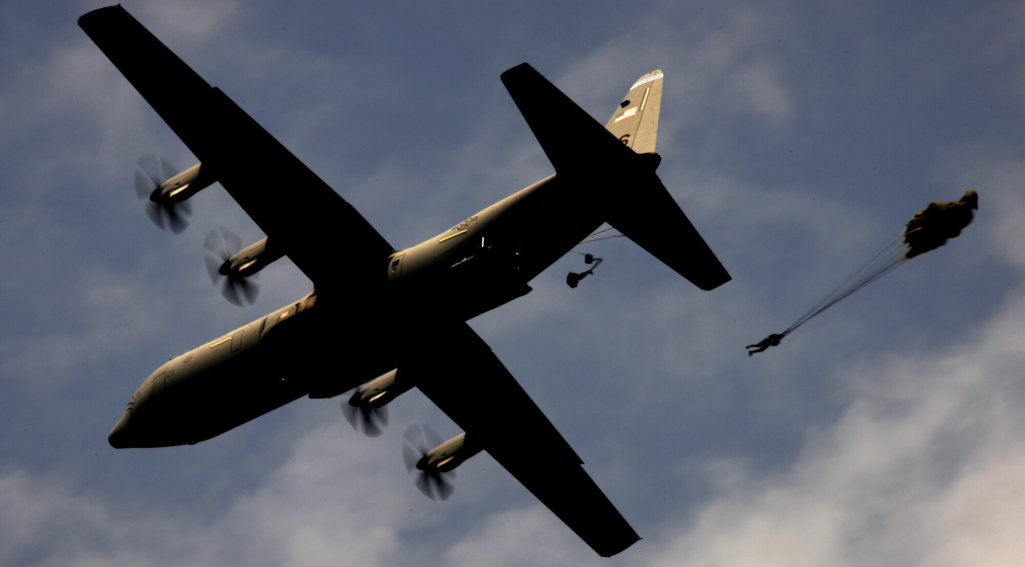 Bulgarian 68th Special Forces Brigade members jump from a U.S. Air Force C-130J during exercise Thracian Spring 2010 at Plovdiv Airport, April 23, 2010. Personnel from the 86th Airlift Wing and 435th Air and Ground Operations Wing are deployed to Plovdiv, Bulgaria in support of Thracian Spring. Thracian Spring is an exercise composed of aircrew, maintenance, airfield management, aerial port, security forces, and logistics personnel that combine their skill in an effort to build and strengthen the United States and Bulgarian Air Forces’ bond while improving interoperability with our partner NATO nation. (U.S. Air Force photo by Master Sgt. Quinton T. Burris)