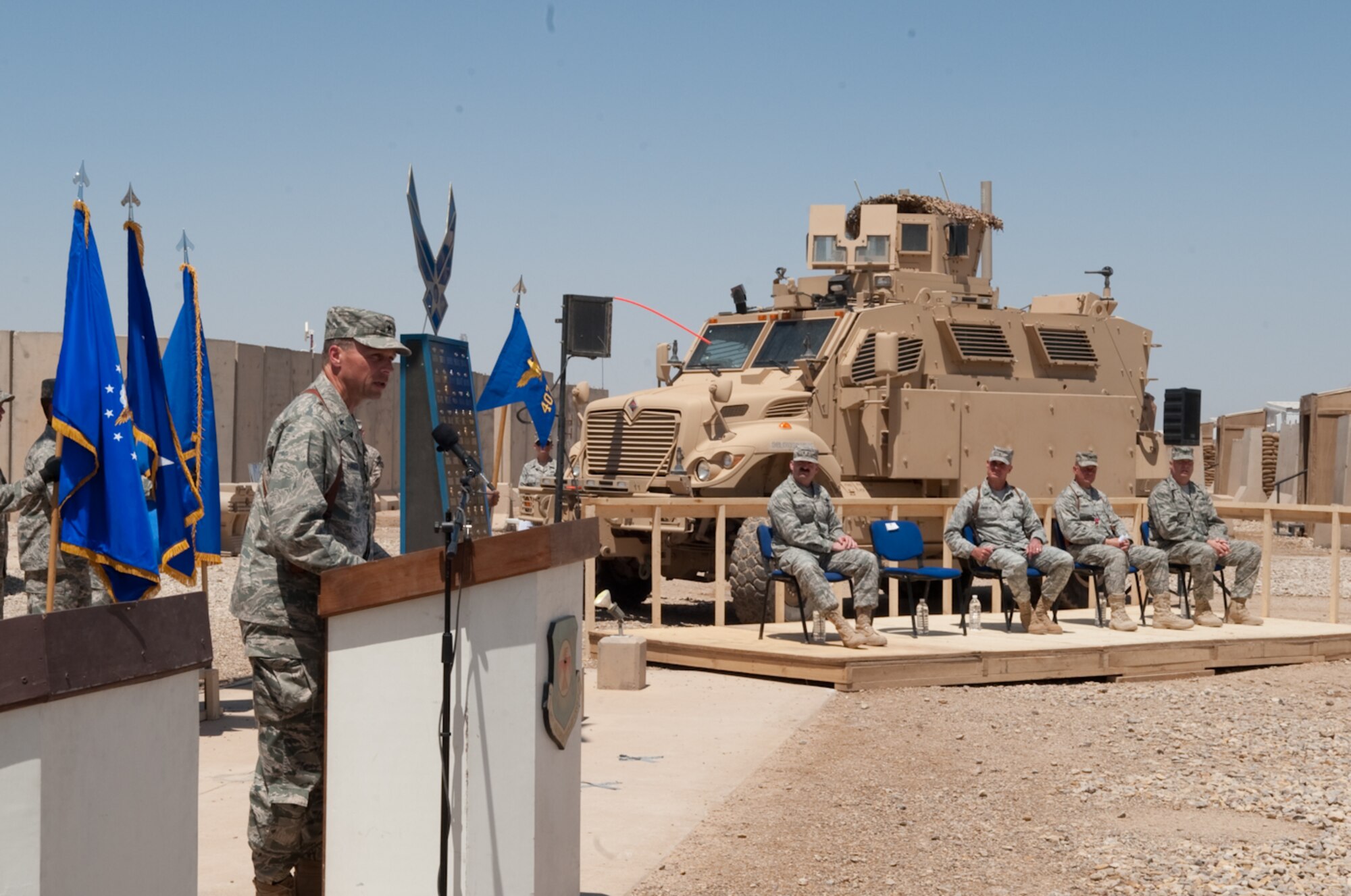 Brig. Gen Scott M. Hanson, commander, 321st Air Expeditionary Wing, addresses the 407th Air Expeditionary Group as their new wing commander during the transfer of authority ceremony at Ali Base, Iraq, April 24, 2010. The mission of the 321 AEW is to train and advise the Iraqi Air Force. (U.S. Air Force photo by Senior Master Sgt. Elizabeth Gilbert/Released)