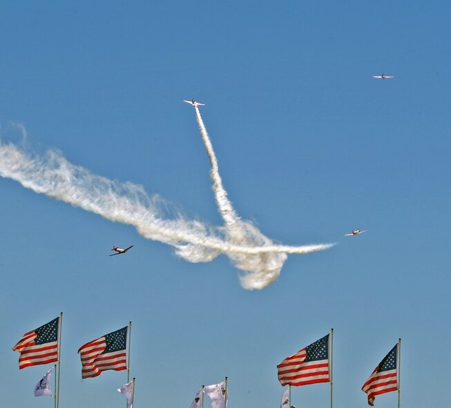 BARKSDALE AIR FORCE BASE, La. -- The Aeroshell Aerobatic Team performs for the crowd during the Barksdale 2010 Defenders of Liberty Air Show here April 24. The aeroshell team has been performing for over 20 years, amassing more than 1,000 hours in front of air show fans all over North America. (U.S. Air Force photo by Senior Airman La'Shanette V. Garrett)(Released)
