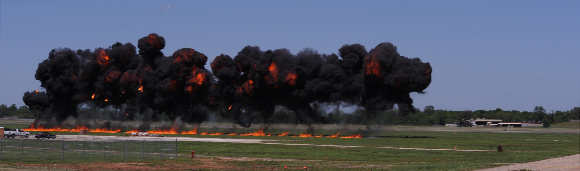 BARKSDALE AIR FORCE BASE, La.  -- The flightline lights up after a B-52 Stratofortress passes by, igniting the wall of fire during the first day of the Barksdale 2010 Defenders of Liberty Air Show here April 24. The wall of fire is a simulated bomb drop. (U.S. Air Force photo by Senior Airman La'Shanette V. Garrett)(Released)