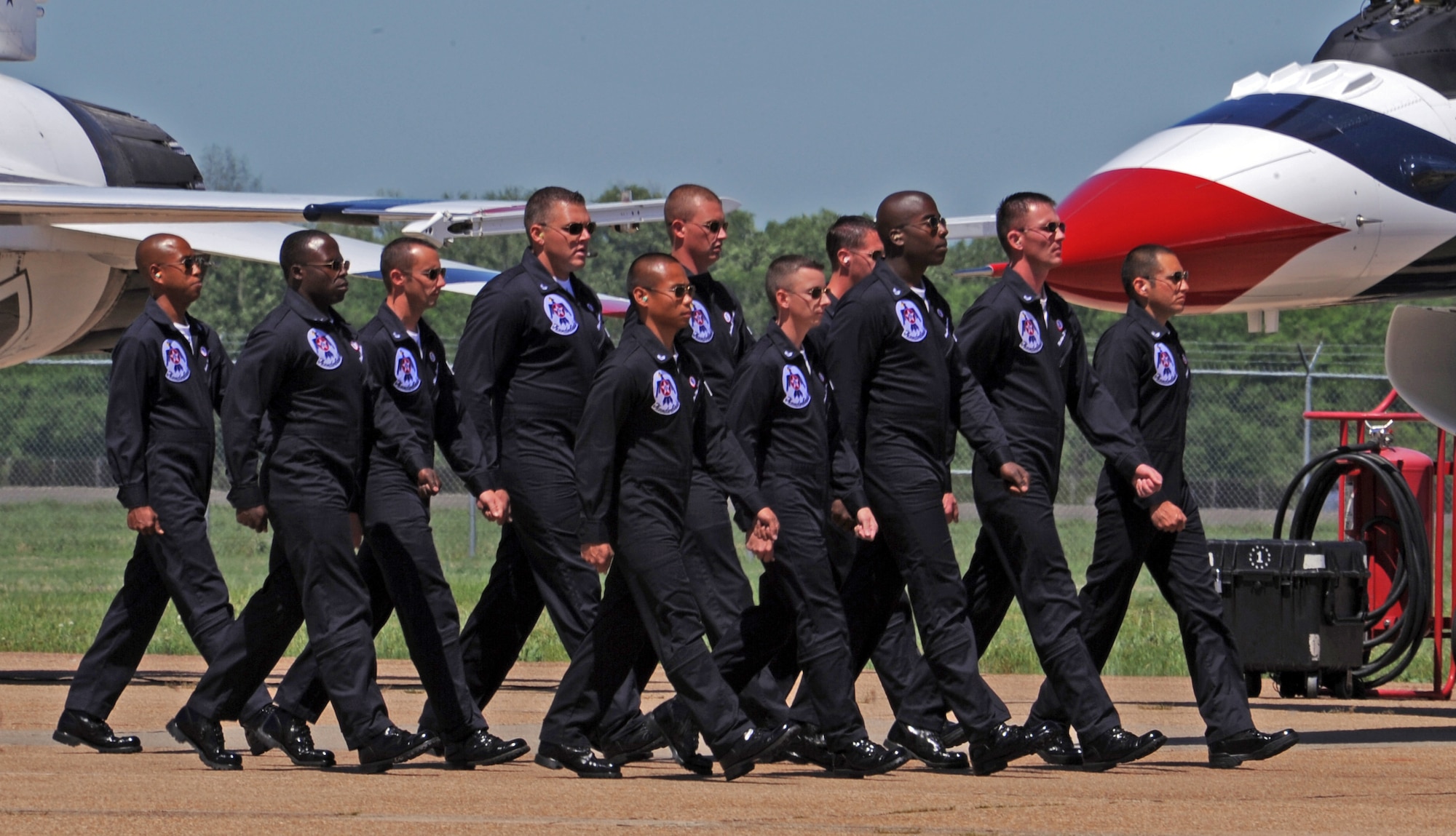 BARKSDALE AIR FORCE BASE, La. -- The U.S. Air Force Thunderbirds crew chiefs performs their ground demonstration for the crowd during the Barksdale 2010 Defenders of Liberty Air Show April 24. The ground demonstration showline consists of 24 enlisted aircraft maintainers who demonstrate the precision, pride and professionalism found on the entire Thunderbird team. (U.S. Air Force photo by Senior Airman La'Shanette V. Garrett)(Released)