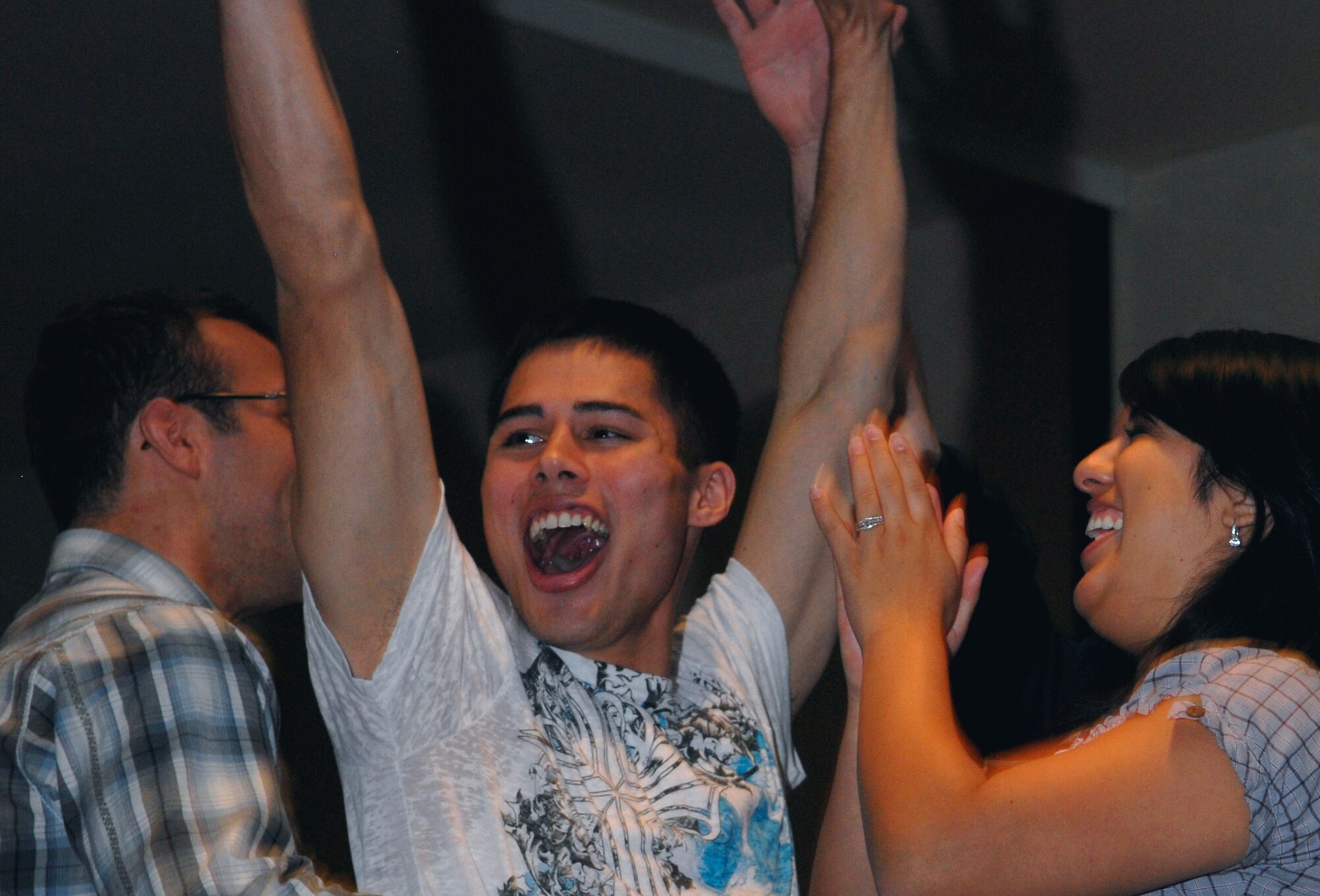 VANDENBERG AIR FORCE BASE, Calif. -- Airman 1st Class Sean Conroy, a Vandy Fued contestant, celebrates a win with his teammates during the Vandy Fued here Friday, April 23, 2010. Twenty teams competed in the Vandy Fued each aiming to win the three bracket game show. (U.S. Air Force photo/Senior Airman Ashley Reed)