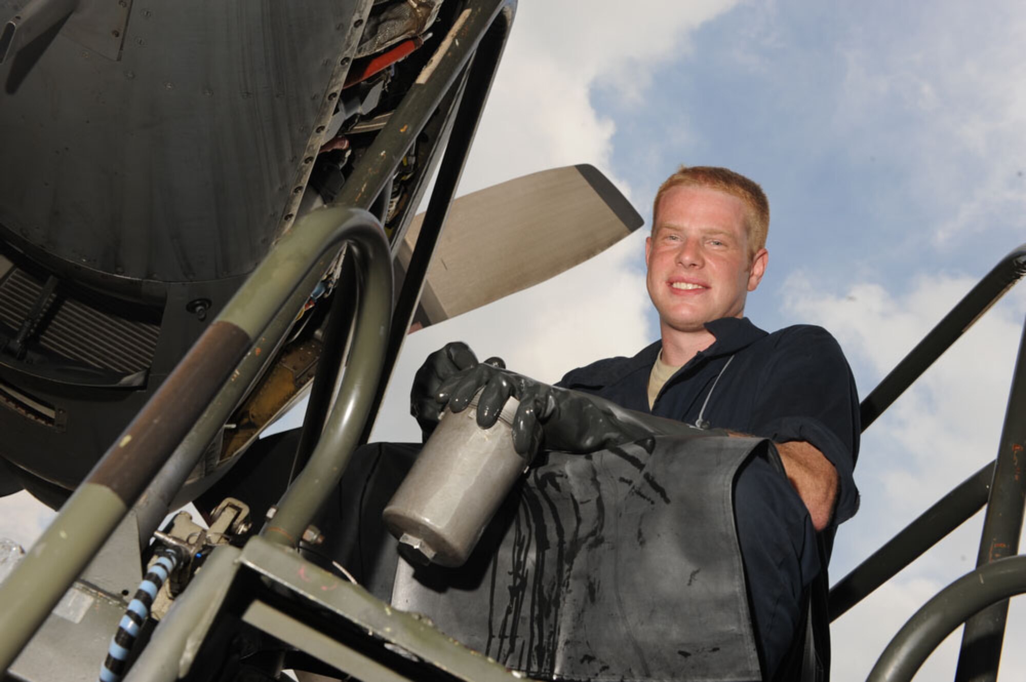 Senior Airman Brian Heimgartner, an aircraft mechanic from the 374th Aircraft Maintenance Squadron at Yokota Air Base, Japan, inspects a C-130 Hercules from Yokota during Cope West 10 on April 22, 2010.  Cope West is a Pacific Air Forces sponsored bilateral tactical airlift exercise involving U.S. and Indonesian air forces. The exercise is designed to advance interoperability between U.S. and Indonesian air forces, and promote cooperation and unity of purpose. (U.S. Air Force photo/Tech Sgt. Cohen A. Young)
