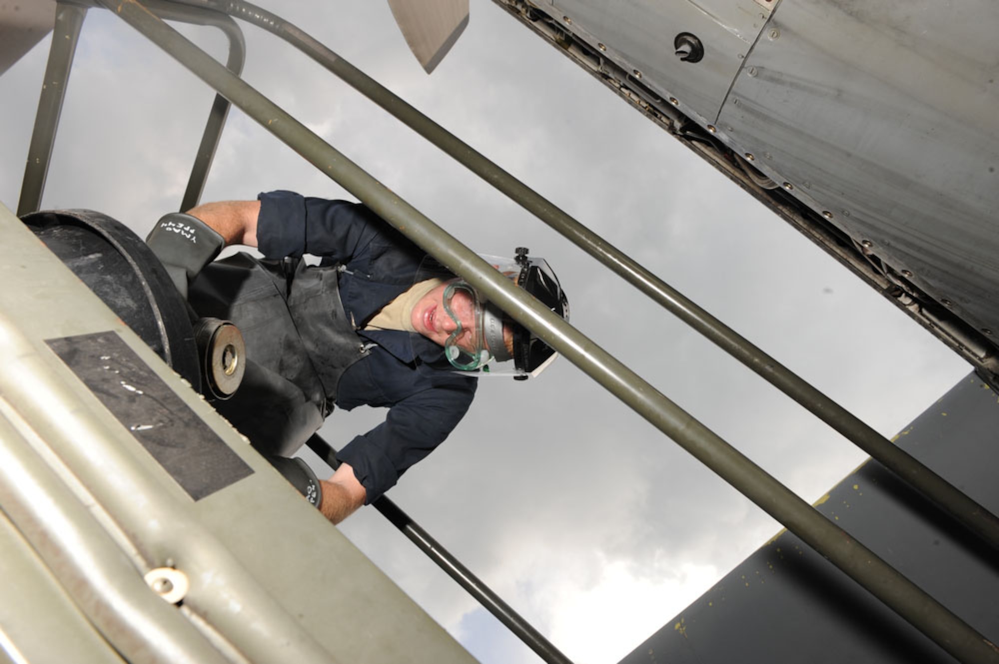 Senior Airman Brian Heimgartner, an aircraft mechanic from the 374th Aircraft Maintenance Squadron at Yokota Air Base, Japan, loosens a casing to check an engine oil leak at Halim AB, Indonesia, during Cope West 10 on April 22, 2010.  Cope West is a Pacific Air Forces sponsored bilateral tactical airlift exercise involving U.S. and Indonesian air forces. The exercise is designed to advance interoperability between U.S. and Indonesian air forces, and promote cooperation and unity of purpose. (U.S. Air Force photo/Tech Sgt. Cohen A. Young)