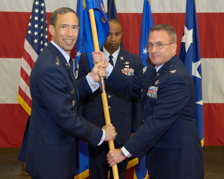 VANDENBERG AIR FORCE BASE, Calif. --  Col. John Moss (right), receives command of the 614th Air and Space Operations Center from Lt. Gen. Larry James, the 14th Air Force commander, here Monday, April 26, 2010.  (U.S. Air Force photo/Airman 1st Class Andrew Lee) 
 