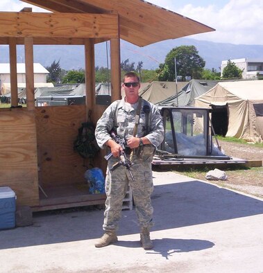 PORT-AU-PRINCE, Haiti -- Staff Sgt. Nathan Carter, 823rd Expeditionary Security Forces Squadron squad leader, provides security at the Toussaint L'Ouverture International Airport in Haiti's capital, Port-au-Prince April 8. “The hardest job in the military is that of the military spouse,” he said. (Contributed photo/RELEASED)