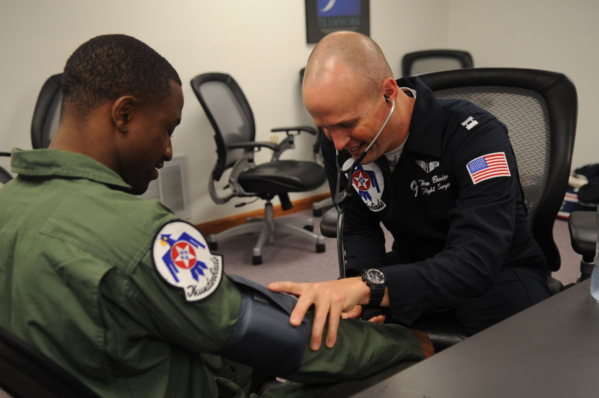 BARKSDALE AIR FORCE BASE, La.--Capt. Thomas Bowden, U.S. Air Force Air Demonstration Squadron "Thunderbirds" flight surgeon, checks the blood pressure of New Orleans Saints Cornerback Jabari Greer, during a medical briefing prior to a flight with the Thunderbirds April 23. A member of the 2010 Super Bowl championship team, Mr. Greer and the team's Quarterback, Drew Brees, had the opportunity to meet with Airmen and their families and fly with the Thunderbirds while the squadron was visting Barksdale Air Force Base to perform in the Defenders of Liberty Air Show April 24-25.  Currently in their 57th show season, the Thunderbirds are scheduled to perform 73 shows across the United States and Canada in 2010. (U.S. Air Force photo by Staff Sgt. Richard Rose)