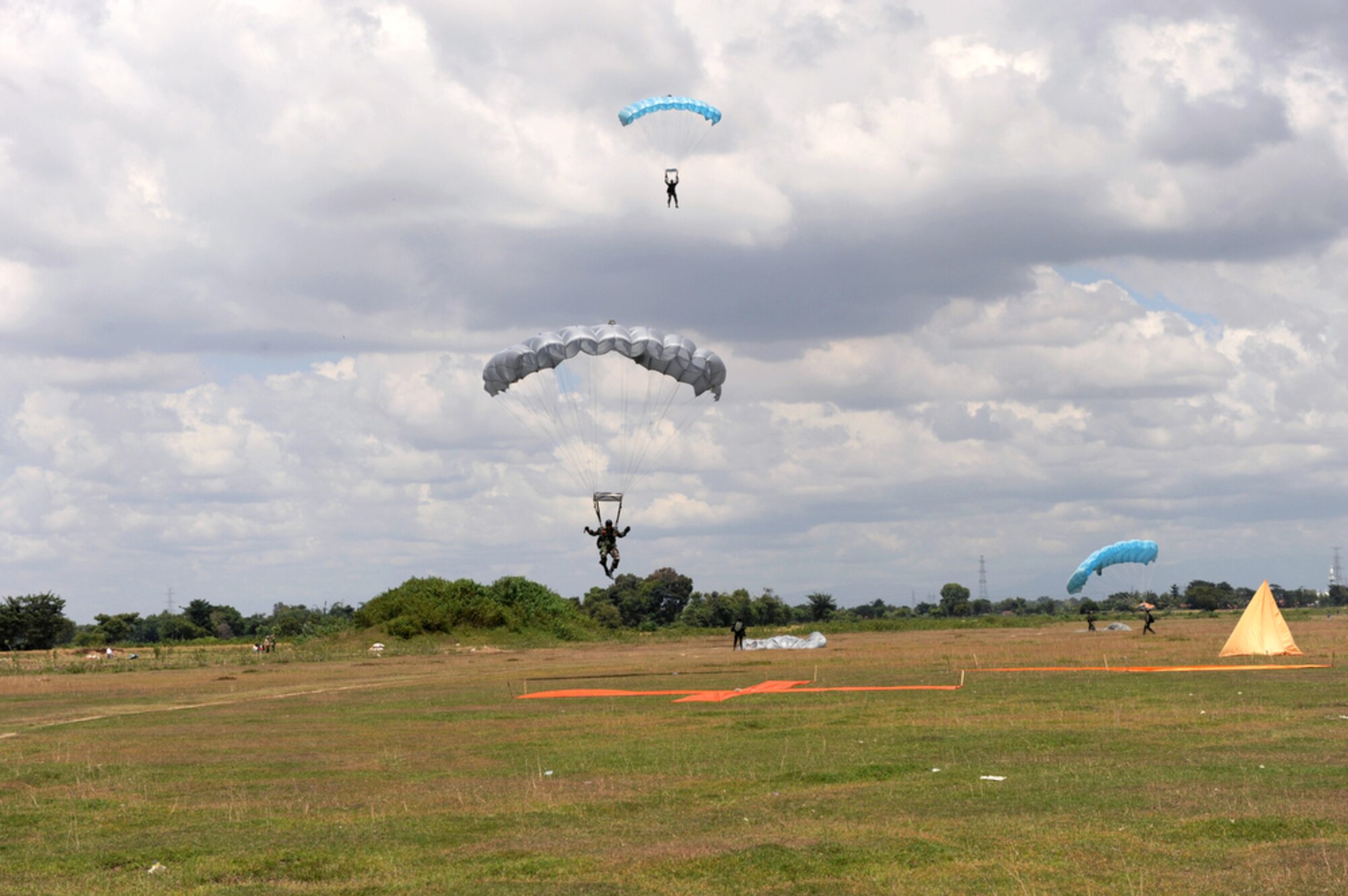 Indonesian jumpmasters land near their mark after completing a high-altitude, low-opening jump from an Air Force C-130 Hercules assigned to the 36th Airlift Squadron at Yokota Air Base, Japan, during exercise Cope West 2010 April 21, 2010, in Indonesia. (U.S. Air Force photo/Tech. Sgt. Cohen A. Young)
