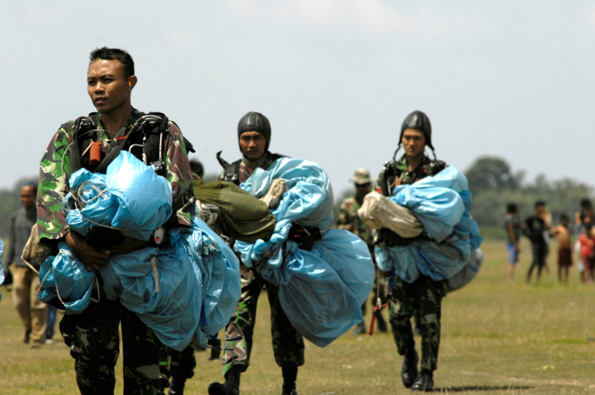 Indonesian airmen complete a high-altitude, low-opening jump from an Air Force C-130 Hercules assigned to the 36th Airlift Squadron at Yokota Air Base, Japan, during Exercise Cope West 2010 April 21, 2010, in Indonesia. (U.S. Air Force photo/Tech. Sgt. Cohen A. Young)