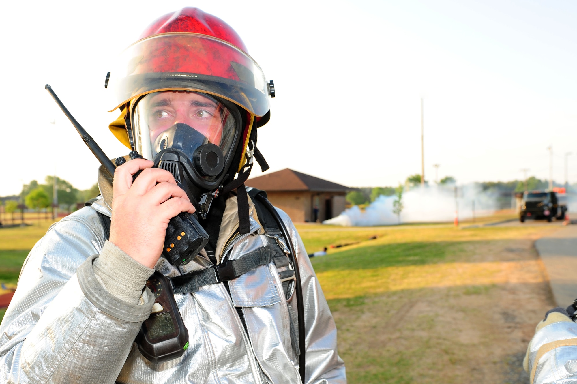Tech. Sgt. Shane Tolison, a 19th Civil Engineer Squadron firefighter, radios for assistance April 21 during an exercise. First-responders took immediate action during the simulated explosion as part of the Air Mobility Command unit compliance inspection for the 19th Airlift Wing. (U.S. Air Force photo by Senior Airman Steele C. G. Britton)