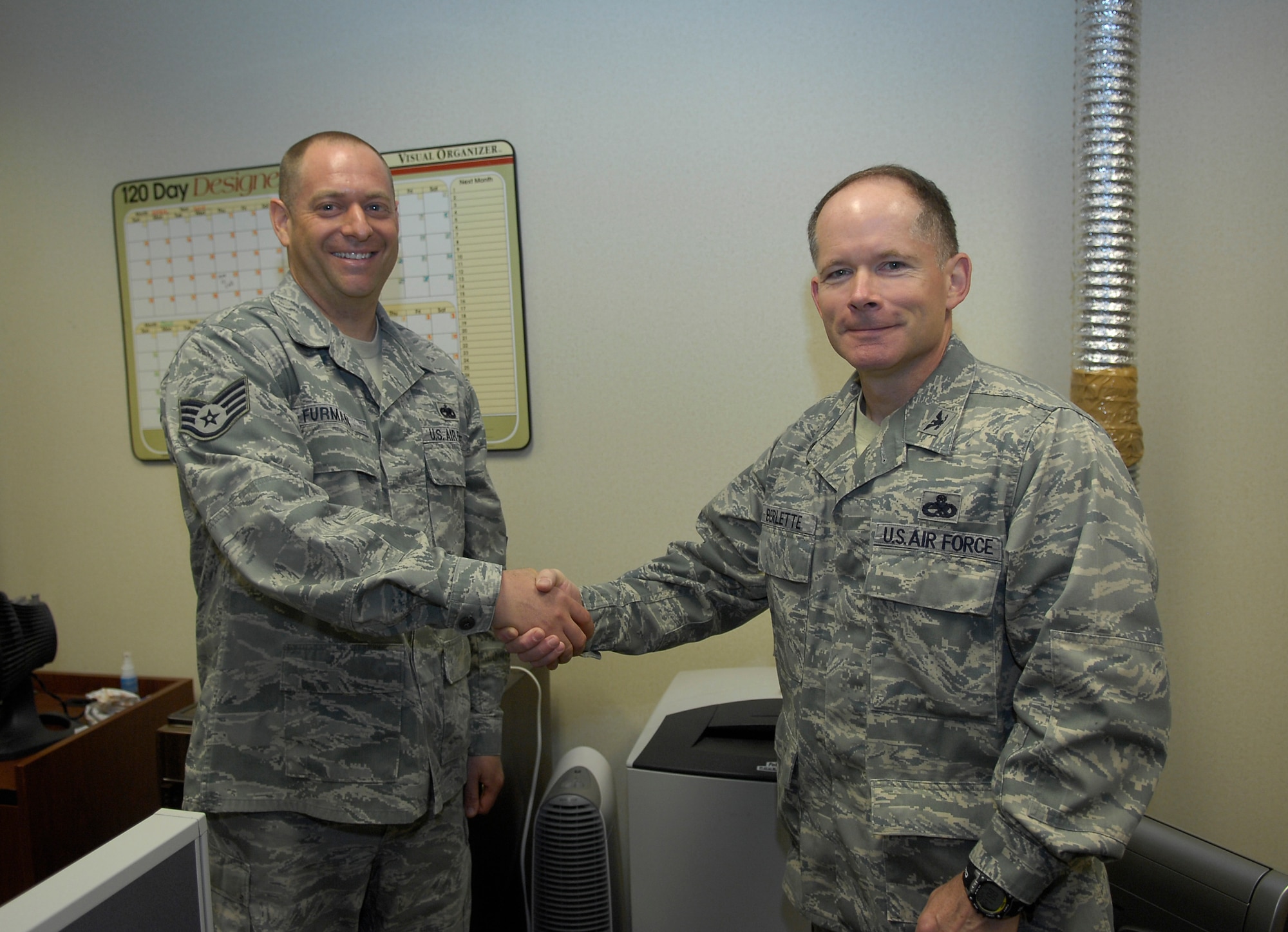 Col. Craig Berlette, 43rd Airlift Wing Vice Commander, presented the Commander’s Coin on behalf of Col. James Johnson, 43rd AW Commander, to Staff Sgt. Dustin Furman, 2nd Airlift Squadron, for his exceptional performance beyond the call of duty, April 20. (U.S. Air Force Photo/Senior Airman Kris Levasseur)
