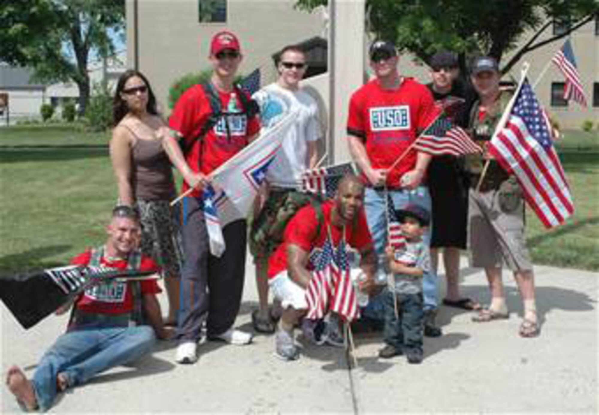 DOVER AIR FORCE BASE, Del.- Eleven Dover Airmen participated in a 47-mile ruck march from New Castle to Dover May 21-22, 2009 to raise funds for USO Delaware. This year's march will begin at the New Castle Air Base, headquarters of the Delaware Air National Guard at 5 p.m., May 20 and end at the base flag pole here around 2 p.m. Last year, five of the Airmen completed the entire march to Dover AFB in 22 hours and 30 minutes. Pictured from left to right are: Airman 1st Class Joe Pelkey, 436th Logistics Readiness Squadron; Staff Sgt. Sarah Gieck, 436th Civil Engineer Squadron; Staff Sgt. Chris Honsiker, 512th Logisitcs Readiness Flight; Senior Airman Levi Martin, 436th LRS; Staff Sgt. Michael Spencer, 512th LRF, and his son Devin, 2; Airman 1st Class Les Busser, 436th LRS; Airman 1st Class Mykel Wilson, 436th LRS; and Tech. Sgt. David Jackson, 512th LRF. (U.S. Air Force photo/Capt. Marnee A.C. Losurdo)
