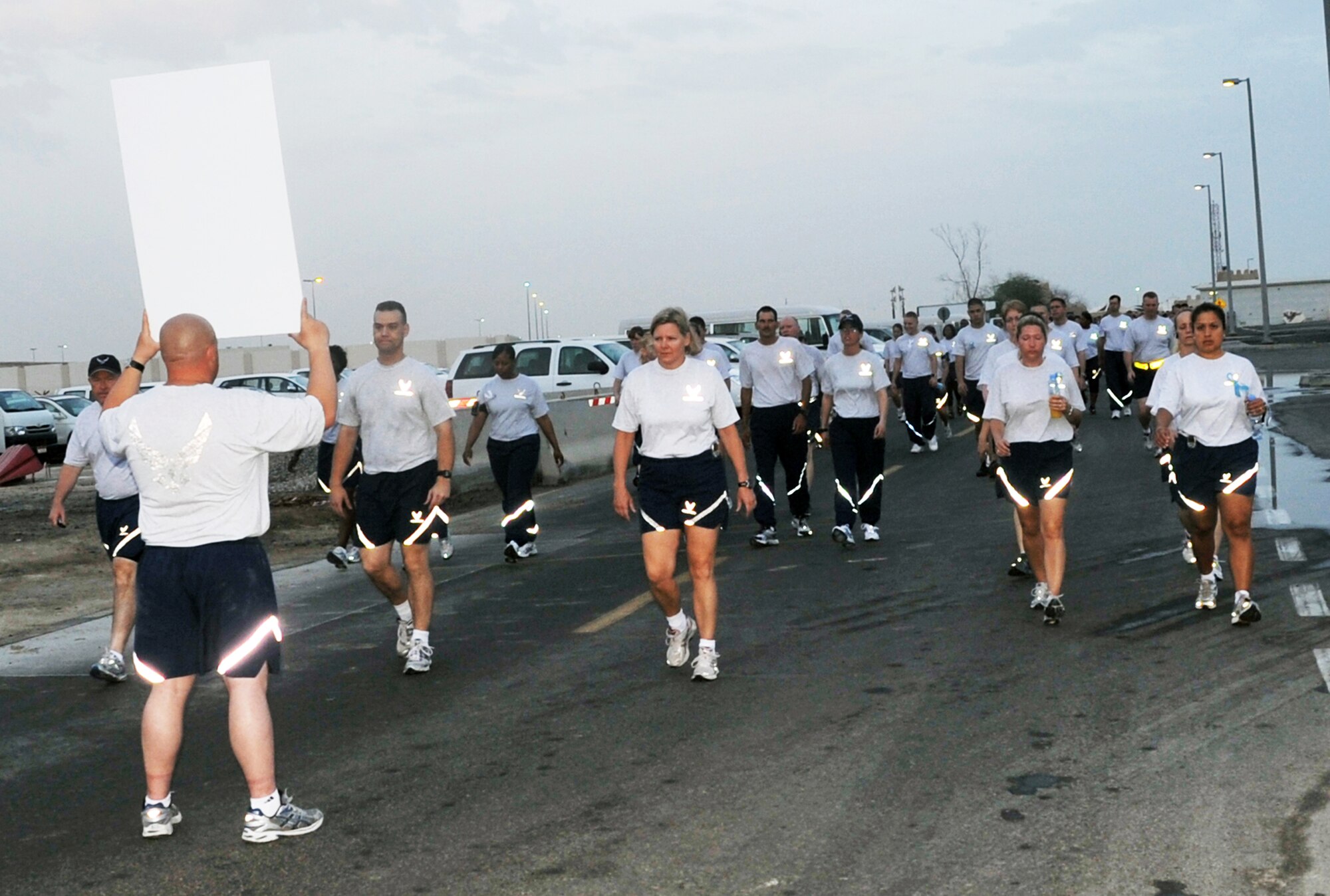 Airmen participate in the "Walk A Mile In Their Shoes" event in observance of Sexual Assault Awareness Month April 19, 2010, at an air base in Southwest Asia. The Airmen are from the 380th Air Expeditionary Wing. (U.S. Air Force Photo/Master Sgt. Scott T. Sturkol)
