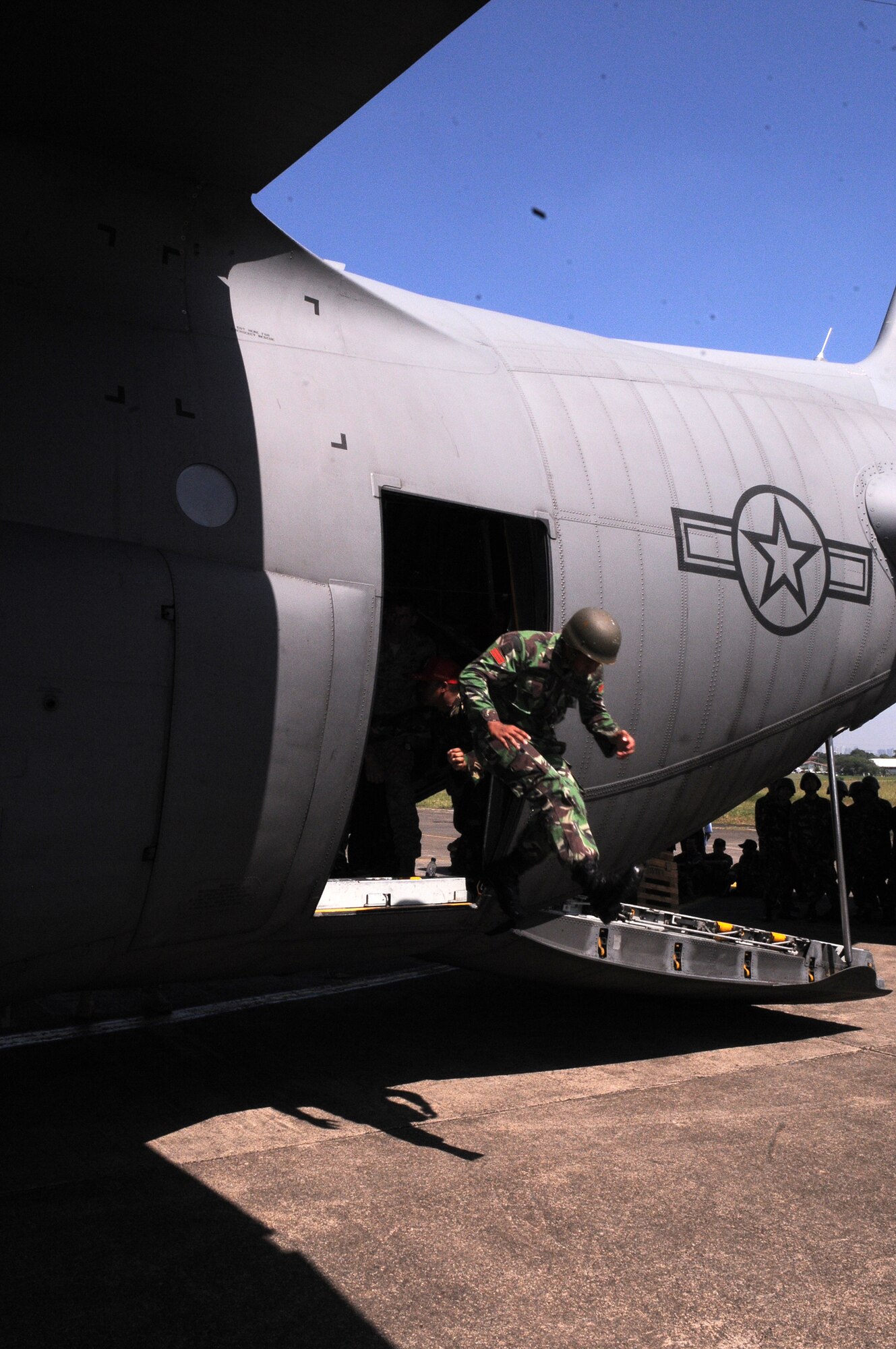 An Indonesian airman jumps from a U.S. Air Force C-130 Hercules during Exercise Cope West April 17, 2010, at Halim Air Base, Indonesia. (U.S. Air Force photo)