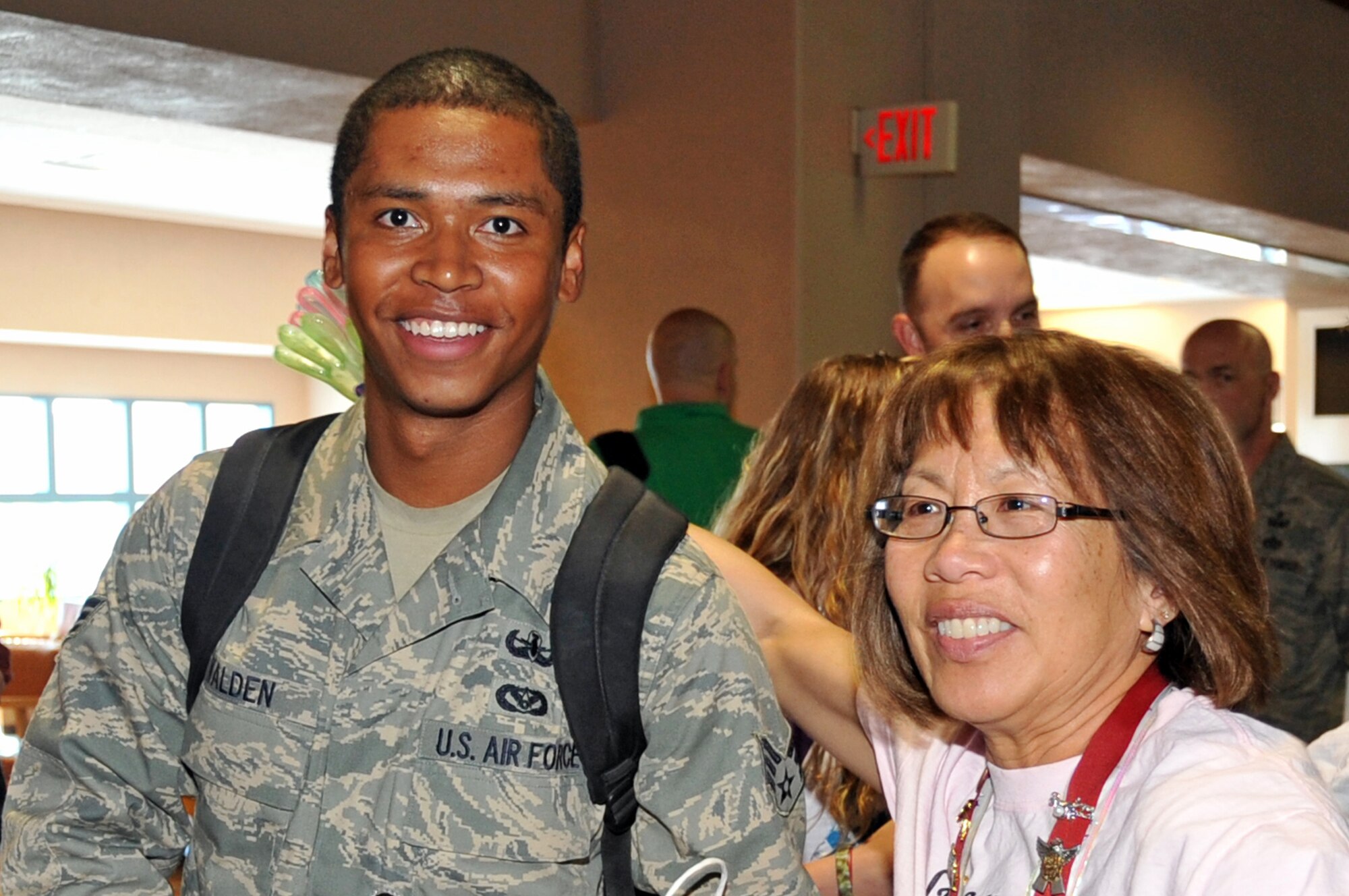 SrA Rafael Walden, EOD, receives a big welcome home from Pearl Trowbridge, Blue Star Mothers, at the Albuquerque International Sunport Airport April 15.  SrA Walden return with two additional EOD airmen all returning from deployment.

U.S. Air Force Photo Elizabeth Martinez