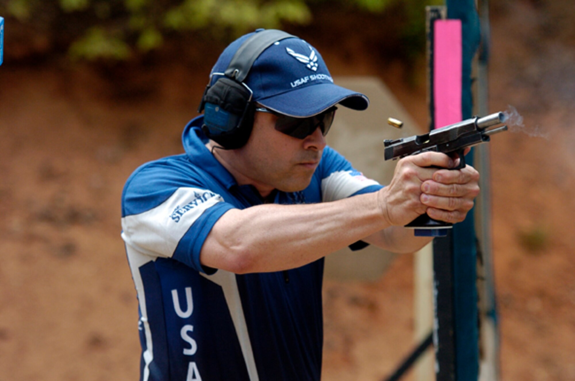Maj. Steven Dennis, team captain for the Air Force Action shooting team, empties a clip at the recent Area 6 championship competition in Convington, Ga., April 17.  Major Dennis, 28th Test and Evaluation Squadron, ranked second-highest military shooter with more than 71 percent in the limited division.  (Courtesy photo by Paul Erhardt.)
