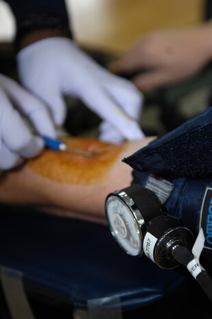 Staff Sgt. Joshua Cox prepares to donate blood at the American Red Cross Blood Drive held at the Fitness and Sports Center on Joint Base Charleston, S.C., April 21, 2010. This is the third blood drive the Red Cross has held at Joint Base Charleston this year. The Red Cross estimated to have more than 100 donators by the end of the day. Sergeant Cox is a military training leader with the 373rd Training Squadron. (U.S. Air Force Photo/Airman 1st Class Lauren Main)