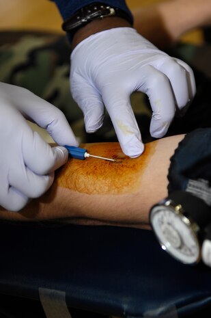 Staff Sgt. Joshua Cox prepares to give blood at the American Red Cross Blood Drive held at the Fitness and Sports Center on Joint Base Charleston, S.C., April 21, 2010. This is the third blood drive the Red Cross has held at Joint Base Charleston this year. The Red Cross estimated to have more than 100 donators by the end of the day. Sergeant Cox is a military training leader with the 373rd Training Squadron. (U.S. Air Force Photo/Airman 1st Class Lauren Main)